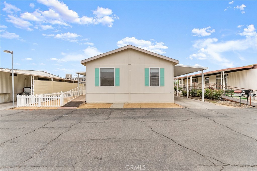 Rare Find in 55+ Community!  Spacious, Updated, Yucaipa Beauty, with 3 Bedrooms, 2 bathrooms. This home features, Newer Water Heater approx 3 mos., Newer A/C  approx 1 yr., updated light fixtures and hardware plus a fully fenced yard! All in a well maintained community with pool/spa and LOW space rent! This IS A MUST SEE!