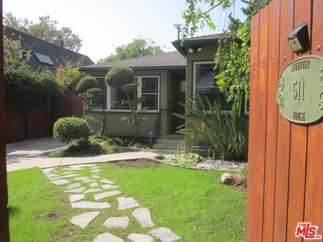 Light-filled single family home located in a prime West Hollywood neighborhood. Hedged and gated for privacy. This lovely home is in absolute move-in condition. The spacious living room features a working fireplace, built-in bookshelves and is pre-wired for video & surround sound. The kitchen offers quartz counters, stainless appliances and custom cabinets. Primary bedroom with ensuite bathroom + closets designed by California Closets. Full sized washer & dryer in laundry room. Central heat and air conditioning, energy efficient dual pane windows, hardwood floors and high-speed CAT6 ethernet wiring throughout - ideal for those who work from home. Peaceful and private Zen-like backyard with a heated outdoor spa - perfect for unwinding and relaxing. There is extra storage space in the garage. This home is close to everything and is the perfect oasis in the city.