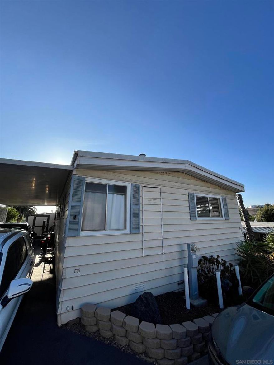 Welcome to this well maintained 3-bedroom, 2-bath mobile home offering 1,440 sq ft of comfortable living space. Situated on one of the largest lots in a family-friendly, all-age park, this home provides extra room to relax, entertain, and enjoy the outdoors. Located directly across from Richland Elementary School and walking distance to Woodland Park Middle School and Mission Hills High School. Home highlights include recently remodeled kitchen with fresh finishes, stylishly updated guest bathroom with modern touches, spacious living and dining areas filled with natural light, extended carport for convenient parking, large shed for storage or hobbies, expansive lot with private outdoor space, stunning foothill and sunset views that elevate everyday living. Close to parks, shopping, dining, and top-rated schools, this home offers the perfect blend of space, comfort, and location. Whether you're starting out, settling down, or simply looking for a peaceful retreat, this San Marcos gem is ready to welcome you.