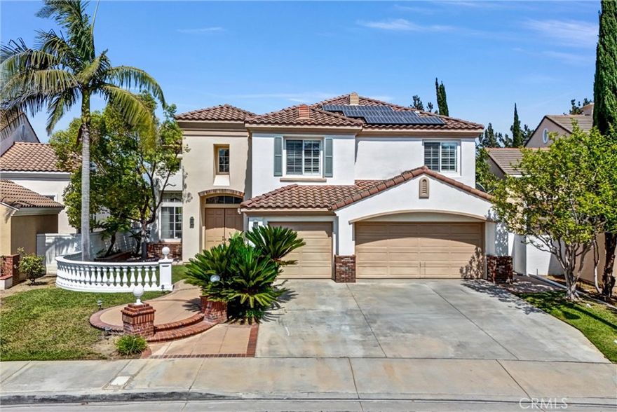 PRICE  CUT 90K !!! This exquisitely remodeled home is located in the prestigious Ridgemoor gated community with 24-hour guard security. Nestled in a serene neighborhood, this romantic residence offers a perfect blend of luxury, comfort, and elegance. As you enter the double door grand foyer, you're greeted by soaring ceilings and an abundance of natural light that flows through the open-concept formal living and dining rooms, highlighted by a dazzling crystal chandelier and an elegant spiral staircase. The gourmet kitchen is a chef’s dream, featuring a large center island, exquisite granite countertops, premium appliances including a Viking stove, a range hood, double ovens, a dish washer, and a microwave. Refaced cabinets with new drawers and doors provide a fresh, modern touch. The cozy family room showcases a classic stone fireplace and marble flooring, perfect for relaxed gatherings. The main floor also features a suite with a full bath, a powder room, a laundry room, a small storage room, an additional spacious storage room, equipped with wood shutter windows overlooking the beautiful backyard. Upstairs, the expansive primary suite offers stunning panoramic views of city lights and mountains through large picture windows. It includes a spacious walk-in closet and a newly upgraded bathroom with newly refaced cabinets, new countertops, dual sinks, lighting, a soaking tub, and a walk-in shower, all designed for both comfort and grandeur. You’ll find 3 other generously sized bedrooms and 2 upgraded bathrooms. Additional stunning features include newly painted walls and ceilings throughout the interior and even the garage, brand new flooring, fully paid-off solar panel system, brand new water heater, new countertops, sinks, mirrors, and lightings, six sparkling crystal chandeliers, wood shutters, professionally landscaped front and backyards with a sparkling swimming pool and spa, showcasing the latest in design and craftsmanship. Enjoy a prime location just minutes from top-rated schools, library, shopping centers, markets, banks, freeways, and a wide array of dining options. This house is much more than just a gracious home, offering both unparalleled luxurious living and a perfect setting for prosperity and success. A must-see in Rowland Heights' most coveted community.