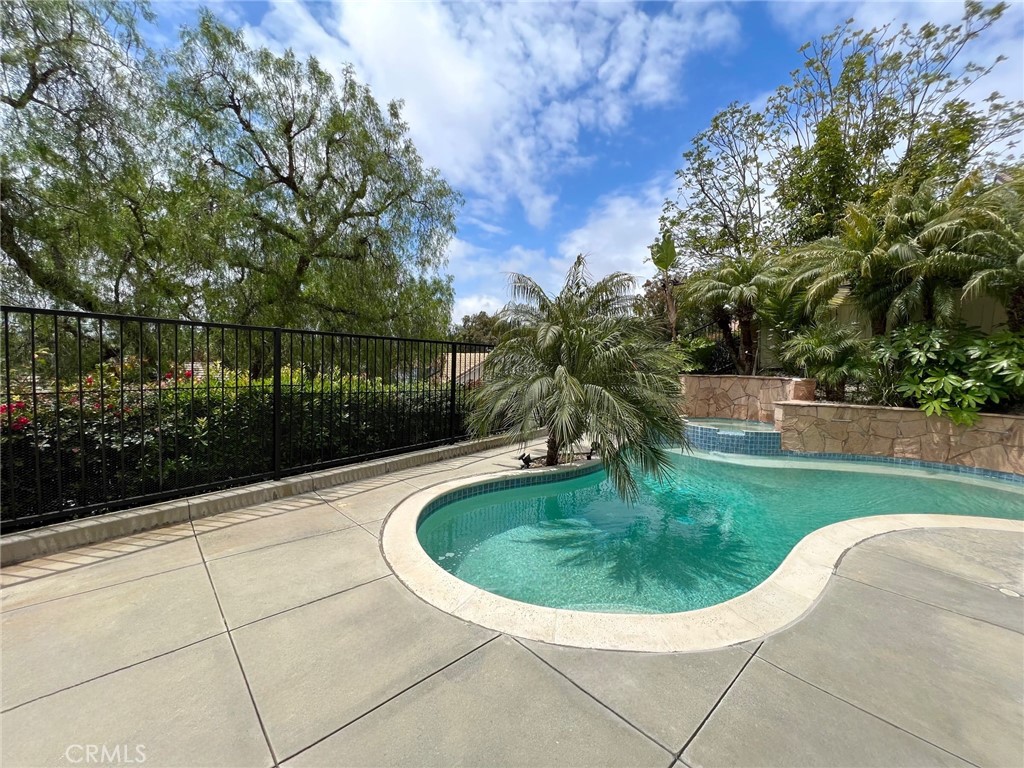 Welcome to this beautifully updated pool home located in the highly sought-after Auburn Ridge neighborhood of South Mission Viejo. Featuring four bedrooms, a main-floor den, and two-and-a-half bathrooms, this spacious and turnkey residence offers the ideal layout for comfortable everyday living.
Abundant natural light fills the home, accentuating the soaring double-height ceilings. The updated kitchen boasts white shaker cabinetry, quartz countertops, a stylish tile backsplash, durable tile flooring, and a modern stainless-steel appliance suite. The adjoining dining area is perfect for both everyday meals and hosting guests.
The inviting family room includes a cozy fireplace and overlooks the private backyard with views of the sparkling pool and spa. A large downstairs den provides a quiet space for a home office or flex room, while the convenient laundry room includes an LG washer and dryer.
Upstairs, the primary suite features vaulted ceilings and an en-suite bathroom complete with dual sinks, a soaking tub, and a separate shower. Three additional upstairs bedrooms and a full bathroom complete the second level.
Enjoy outdoor living year-round with a beautifully landscaped backyard that includes a pool, heated spa, and a patio area ideal for dining and relaxation. Conveniently located near parks, golf courses, shopping, dining, and within a top-rated school district, this exceptional home offers both comfort and convenience in one of Mission Viejo’s most desirable communities.