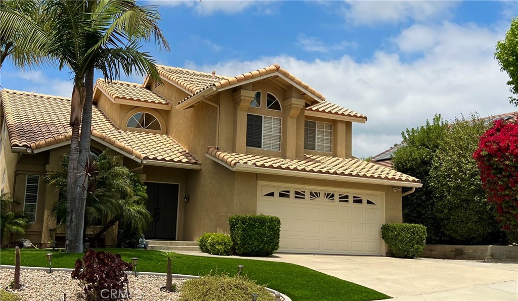 Welcome to this beautifully updated pool home located in the highly sought-after Auburn Ridge neighborhood of South Mission Viejo. Featuring four bedrooms, a main-floor den, and two-and-a-half bathrooms, this spacious and turnkey residence offers the ideal layout for comfortable everyday living.
Abundant natural light fills the home, accentuating the soaring double-height ceilings. The updated kitchen boasts white shaker cabinetry, quartz countertops, a stylish tile backsplash, durable tile flooring, and a modern stainless-steel appliance suite. The adjoining dining area is perfect for both everyday meals and hosting guests.
The inviting family room includes a cozy fireplace and overlooks the private backyard with views of the sparkling pool and spa. A large downstairs den provides a quiet space for a home office or flex room, while the convenient laundry room includes an LG washer and dryer.
Upstairs, the primary suite features vaulted ceilings and an en-suite bathroom complete with dual sinks, a soaking tub, and a separate shower. Three additional upstairs bedrooms and a full bathroom complete the second level.
Enjoy outdoor living year-round with a beautifully landscaped backyard that includes a pool, heated spa, and a patio area ideal for dining and relaxation. Conveniently located near parks, golf courses, shopping, dining, and within a top-rated school district, this exceptional home offers both comfort and convenience in one of Mission Viejo’s most desirable communities.