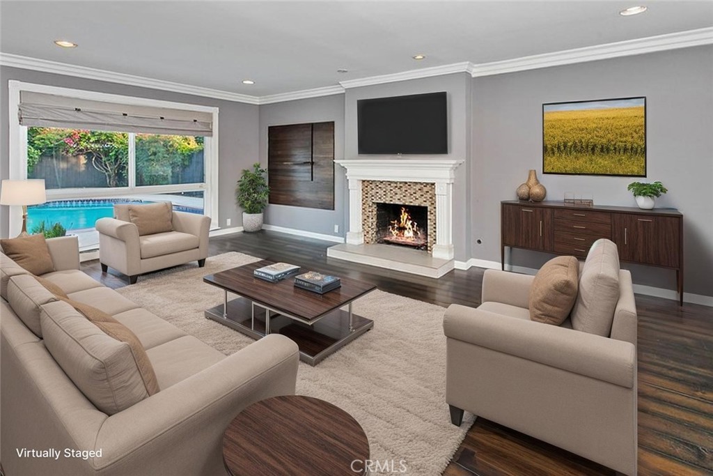 Step into this West Hills entertainer’s home, where every detail has been thoughtfully REMODELED for comfort and style. Nestled on a quiet, tree-lined street, this home boasts a SPARKLING IN-GROUND POOL, SOLAR PANELS, BATTERY BACK-UP, and a LEVEL 2 CAR CHARGER, plus a versatile BONUS ROOM that could easily become a 5th BEDROOM. The 7,769 sq. ft. lot welcomes you with a front lawn, colorful flowerbeds, raised brick planters, and shade and fruit trees that make the covered entryway simply irresistible. Inside, the bright and open floor plan flows naturally, offering approximately 1,844 sq. ft. of living space. Imagine cozying up in the family room, bathed in sunlight through large bay windows, while the custom tiled fireplace adds a warm, inviting touch. The chef’s kitchen is ready for every culinary adventure, with ceiling-height cabinetry, sparkling counters, a breakfast bar, and stainless steel appliances which includes a Frigidaire® self-cleaning 5-burner gas range with Arietta® ventilation hood and Frigidaire® dishwasher— perfect for casual meals or entertaining friends. Adjoining the kitchen, the dining room features elegant crown molding and French doors that open to the outdoors, creating a seamless indoor-outdoor experience. The home offers 4 bedrooms and 2.5 bathrooms, including an oversized primary suite filled with light, dual closets, and a private en suite with dressing/vanity area, and a privacy area with a glass-enclosed step-in shower — your personal retreat at the end of the day. Downstairs, the bonus room with backyard access is perfect for an office, hobby space, or an extra bedroom, while an indoor laundry room with checkerboard tile keeps life organized. Step outside to your private backyard oasis, complete with a sparkling in-ground pool, open patio, fenced grassy area, vibrant flowerbeds, and an oversized storage shed — ideal for summer gatherings or quiet evenings under the stars. With a 2-car garage, central air, and heat, this home combines modern convenience with effortless style. Whether you’re hosting friends, enjoying family time, or simply relaxing in a sunlit corner, this West Hills home is ready to welcome you — a place to make lasting memories in a neighborhood you’ll love coming home to