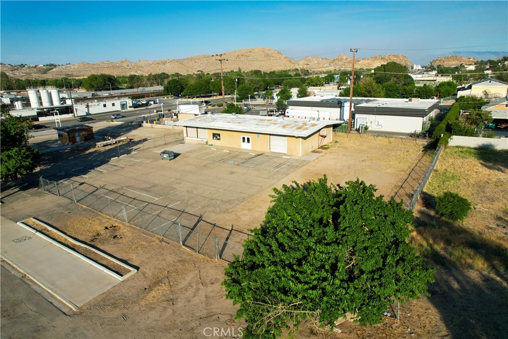 Now Available for Sale or Lease – This versatile ±3,240 SF warehouse situated on ±0.48 acres features a fully fenced and secured yard, ideal for equipment storage, fleet parking, or inventory management. The building is equipped with one ground-level door and two dock-high doors, providing excellent functionality for distribution, service-based businesses, or other commercial uses. Located less than one mile from Interstate 15, the property offers outstanding regional access. With ample open workspace and two restrooms, this property presents a compelling opportunity for owner-users, investors, or tenants seeking a highly functional and accessible industrial facility.