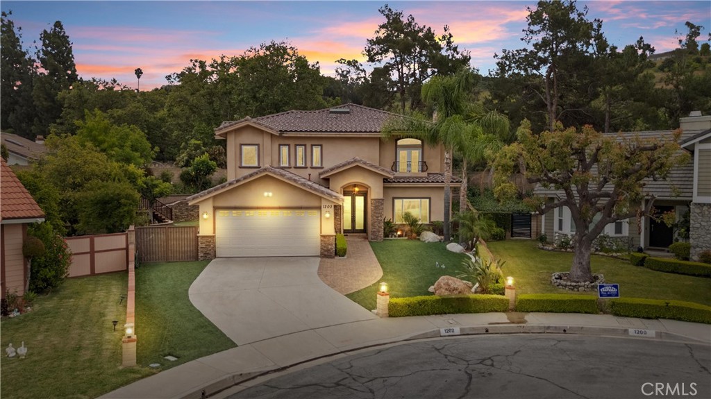 **Offer 20K Grant from City National Bank which can be applied to the down payment/closing costs or a loan program at 5.58% interest rate.**Welcome to a Rare Custom Dream Home in Walnut's Premier Enclave the kind of home you don’t come across often—a fully custom retreat rebuilt from the ground up in 2014, tucked away on a quiet cul-de-sac in one of Walnut’s most sought-after neighborhoods and within the top-rated Walnut Valley Unified School District.
From the moment you arrive, this home impresses with its grand presence, but it’s what’s behind the doors that truly sets it apart: a resort-style backyard oasis designed for unforgettable moments. Imagine opening your bi-fold sliding doors and stepping into your own private sanctuary—complete with lush gardens, a calming waterfall, low-maintenance turf, built-in BBQ, and an integrated speaker system. Whether you’re hosting a summer dinner party or enjoying a quiet sunset with a glass of wine, this outdoor space makes every day feel like a vacation.
Inside, you'll find over 3,276 square feet of bright, beautifully designed living space—featuring 4 spacious bedrooms, 4 spa-like upgraded bathrooms, a California Room, and a flexible loft perfect as a home office or retreat with sweeping hilltop views. This is on a 0.23 acre LOT size.
The open-concept floor plan is airy and inviting, filled with natural light, soaring ceilings, and high-end finishes. The formal living and dining rooms are anchored by fireplaces, while the chef’s kitchen flows seamlessly into the family room—complete with quartz countertops, a stunning glass tile backsplash, a walk-in pantry, Wolf appliances, and a large central island built for everyday living and entertaining.
Every detail has been thought out—from the fully paid-off solar system, custom staircase, and dual-zone HVAC, to the surround sound, copper plumbing, and recessed lighting throughout.
All this, located minutes from parks, shopping, and major freeways (60, 57 & 10), and close proximity to award-winning schools like Walnut High School, Mt San Antonio College, and Cal Poly Pomona. Perfect for the family and the convenience.
This isn't just a home—it's a lifestyle upgrade in one of the most desirable pockets of Walnut.
Come experience it for yourself. Opportunities like this don’t come around often.