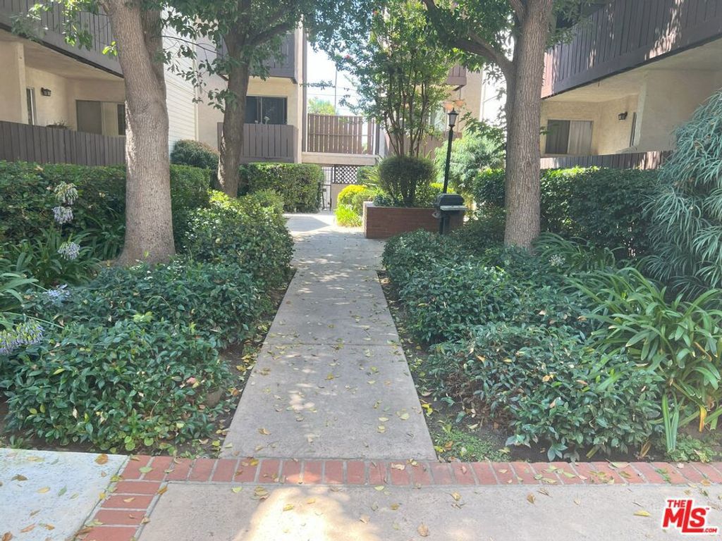 Photo of 15070 Victory Boulevard #103, Van Nuys, CA 91411 (MLS # 25567531)