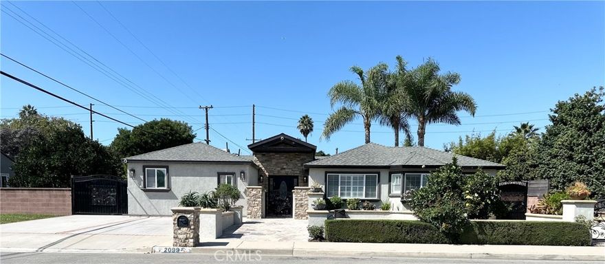 This gorgeous gem of a home has been completely upgraded and remodeled, blending timeless design with modern luxury. As you approach the property, you're welcomed by stunning Three Rivers flagstone—an exclusive feature that sets the tone for the interior. The entry foyer is spacious and grand, with soaring vaulted ceilings that immediately elevate the experience of the home. Inside, European travertine floors extend throughout the living spaces, the three bedrooms are finished with rich engineered hardwood, combining warmth and sophistication in every detail. The chef’s kitchen is a centerpiece, offering a 48” Wolf cooktop, a large pantry, granite countertops, a breakfast island, and exposed beam ceilings. Its open-concept layout flows seamlessly into the family room, which is equipped with in-ceiling surround sound speakers—perfect for entertaining or relaxed evenings at home. The middle bedroom functions as a junior primary suite and includes a full bathroom as well as an attached bonus room or office with vaulted ceilings. The main primary suite is expansive, with a huge walk-in closet, soaring ceilings, and a luxurious five-piece bathroom featuring dual sinks and generous counter space. The backyard is an entertainer’s dream, with a covered patio, three beautiful, well-groomed palm trees, built-in BBQ island, an attached deck, and finished planters, including several citrus and fruit trees. There is a detached two-car garage located at the rear of the property.
 Located near the beautiful Canyon Park and the Santa Ana River Trail, this residence not only architectural excellence but also an unbeatable location for outdoor enjoyment. This is a rare opportunity for discerning tenants looking for high-end living in a peaceful, impeccably maintained setting combining top notch luxury with an intelligent floor plan.