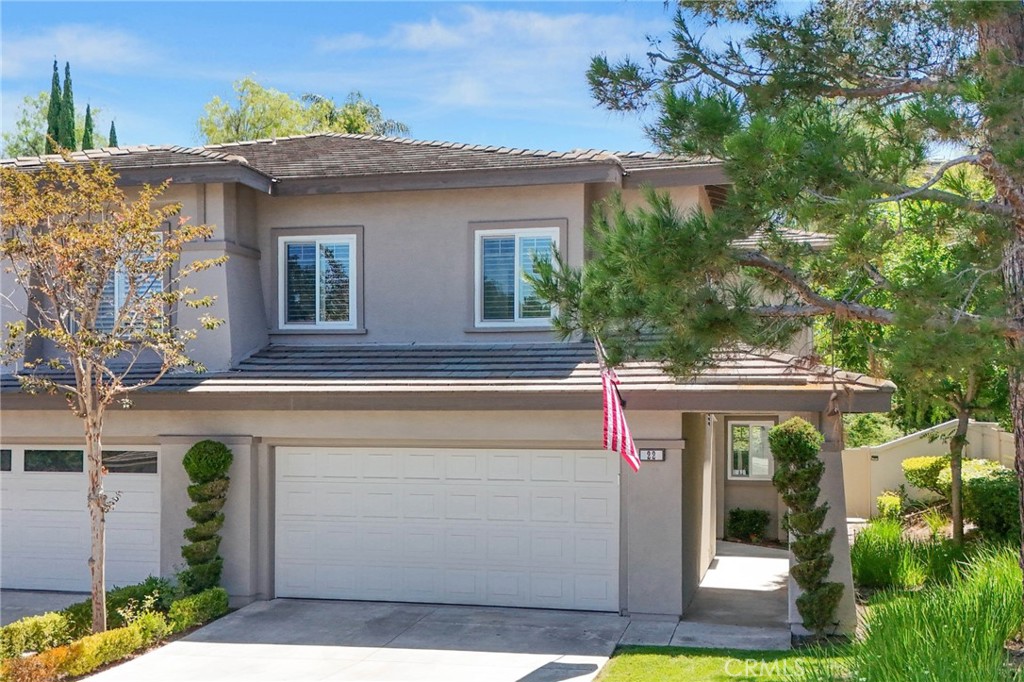 Located in the prestigious guard-gated community of Coto de Caza, this beautifully upgraded 3-bedroom, 2.5-bathroom home offers 1,556 square feet of stylish and functional living space. Step inside to soaring two-story ceilings and a light-filled living and dining room anchored by a cozy fireplace, creating a warm and inviting space for both everyday living and entertaining. The kitchen is a showstopper with white shaker cabinets, quartz countertops, stainless steel appliances, and a sliding glass door that opens to a private patio—perfect for seamless indoor-outdoor dining and relaxation. Upstairs, the spacious primary suite offers a tranquil retreat complete with a private balcony overlooking the backyard. The en-suite bathroom features dual sinks, a walk-in shower, and built-in custom cabinetry, combining comfort and convenience. For year-round climate control, the home includes a whole house fan and ceiling fans throughout, along with Milgard dual-pane windows for added comfort and efficiency. Two additional bedrooms and a full bath provide flexibility for family, guests, or a home office. The main level includes a laundry room and a convenient powder room. The attached direct-access two-car garage features epoxy flooring and built-in cabinetry for extra storage. Step outside to your oversized, private entertainer’s backyard—an outdoor oasis thoughtfully designed for both lively gatherings and serene moments. It features lush artificial turf and a built-in elevated seating area, perfect for hosting weekend barbecues, outdoor movie nights, or simply unwinding in a peaceful, low-maintenance setting. Ample nearby parking adds to the convenience of this exceptional home. Residents of Coto de Caza enjoy an unmatched lifestyle with access to private country clubs, Robert Trent Jones-designed championship golf courses, equestrian trails, parks, and top-rated schools. With low taxes and no Mello-Roos, this home offers the perfect blend of luxury and value. This is your moment—make it count. Schedule your private showing and step into the lifestyle you’ve been waiting for!