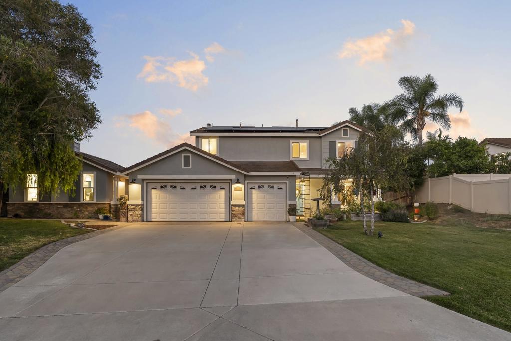 Discover a unique blend of privacy, space, and versatility. Set on a quiet flag lot with nearly a half acre (18,178 SF) of land, this property offers the rare combination of seclusion and convenience, creating the perfect setting for multi-generational living. The main home boasts 5 bedrooms and 2.5 baths, while the full 1BD/1BA accessory dwelling unit with private entrance and updated kitchen is ideal for extended family, guests, or rental income. Inside you will notice the spacious living areas designed for comfort (see supplement) and connection, including a large living room, adjacent formal dining room, and a huge family room off the kitchen that is perfect for larger families and entertaining. Modern upgrades enhance both comfort and efficiency, including a solar system, dual pane windows, tankless water heater, and dual-zone HVAC. Freshly painted interiors, refreshed kitchen, and gorgeous remodeled bathrooms elevate the homes appeal and value, while flexible living spaces adapt seamlessly to your lifestyle needs. You will love the luxury vinyl plank on the 2nd floor and ADU. The owner purchased enough material, stored in the garage, to complete the entire first floor and will include this flooring material in the sale. The huge deck off the primary suite overlooks the massive yard and mountains in the distance. Or relax with friends and family on your covered patio area. The expansive lot provides ample room to chill, entertain, or expand, and with no HOA or Mello Roos fees, you will enjoy freedom and value. Perfectly located near shopping, dining, schools, and Oceansides vibrant coastal lifestyle, this residence is equal parts functional, flexible, and inviting. Whether you are seeking a private retreat, a multi-generational solution, or a house hacking opportunity, this home offers it all!