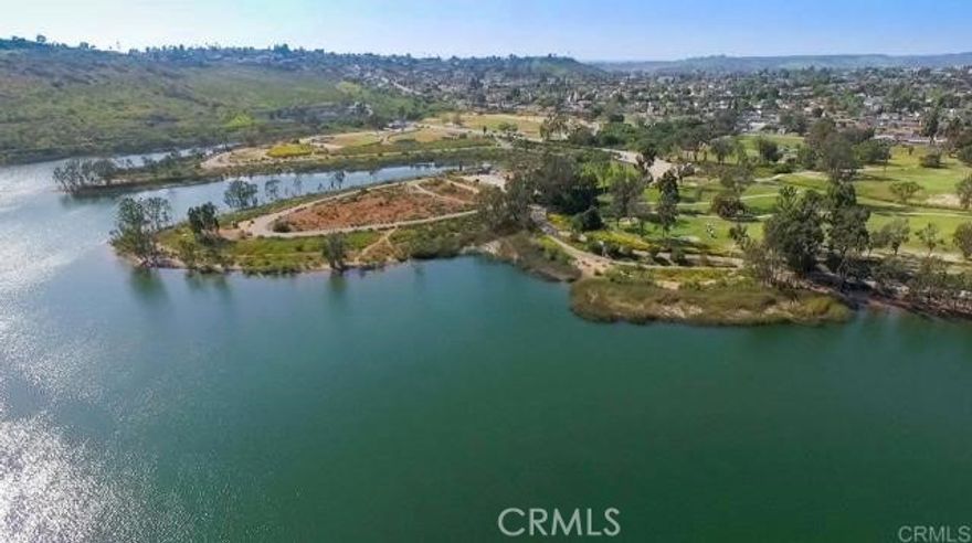 This is a spectacular opportunity to own a lake-view condo that is a stone's throw from some of the best walking trails in La Mesa. This 2 bedroom, 2 bath condo offers 180-degree views of Lake Murray from every room and has large picture windows that allow an abundance of natural light throughout the day. With 950 square feet, this inviting residence has a bedroom and a full bath on each side of the living room, so converting it into an office or having guests stay over would be very convenient. Not only is this condo located around desirable shopping and delicious dining, but it also has amenities that make you feel like youre at a resort. These beautifully landscaped grounds offer 2 ponds, 5 swimming pools, 4 spas, a gym with new equipment, pickleball courts, tennis courts, RV parking, a recreational room to rent out with a full kitchen, a billiards room, and even a carwash. The unit has one free parking space and plenty of guest parking. The laundry room is located right across from the unit, making it feel like it has in-unit laundry that is quick and accessible. If you want to escape your day-to-day life and get lost in your thoughts, all you have to do is walk down behind the unit, and immerse yourself in the 6-mile walk around Lake Murray, and enjoy the beautiful lake with incredible sunsets in the evening.