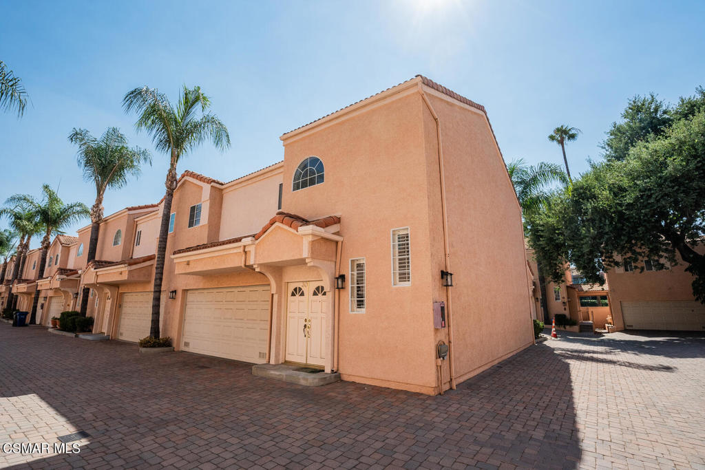 Welcome to this very desirable guard gated Four Oaks Townhome in Encino which is a centrally located end unit. Proceed through its double door entry to the Living or Great room which has a central cozy fireplace, a bar area, recess lighting, and a French window door to the patio. Adjacent is the dining area and kitchen featuring stainless steel appliances; ample cabinetry; attractive tile countertops; and recess lighting. On the ground floor off the entry there is a convenient guest bathroom and direct interior access to and from the 2-car garage. Tour upstairs by way of the open ''U-shaped'' staircase illuminated by its decorative accent windows leading to the primary bedroom and second ensuite, each with vaulted ceilings and windows with plantation shutters. The primary bedroom has a romantic fireplace and two spacious walk-in closets. The generously remodeled primary bathroom offers large tile flooring; double sinks; and a separate shower, tub and toilet room. The second ensuite also has a large walk-in closet, 2 additional closets, and full bathroom. The community amenities include well-maintained landscaped grounds; use of attractive pavers for some driveways and walkways; and a common pool, spa, his and her saunas, gym, and club house. Other features and amenities: plantation shutters; included with the HOA are 24-hour security personnel and high-tech surveillance systems; close to restaurants, schools, parks, shopping, recreation, and easy freeway access.