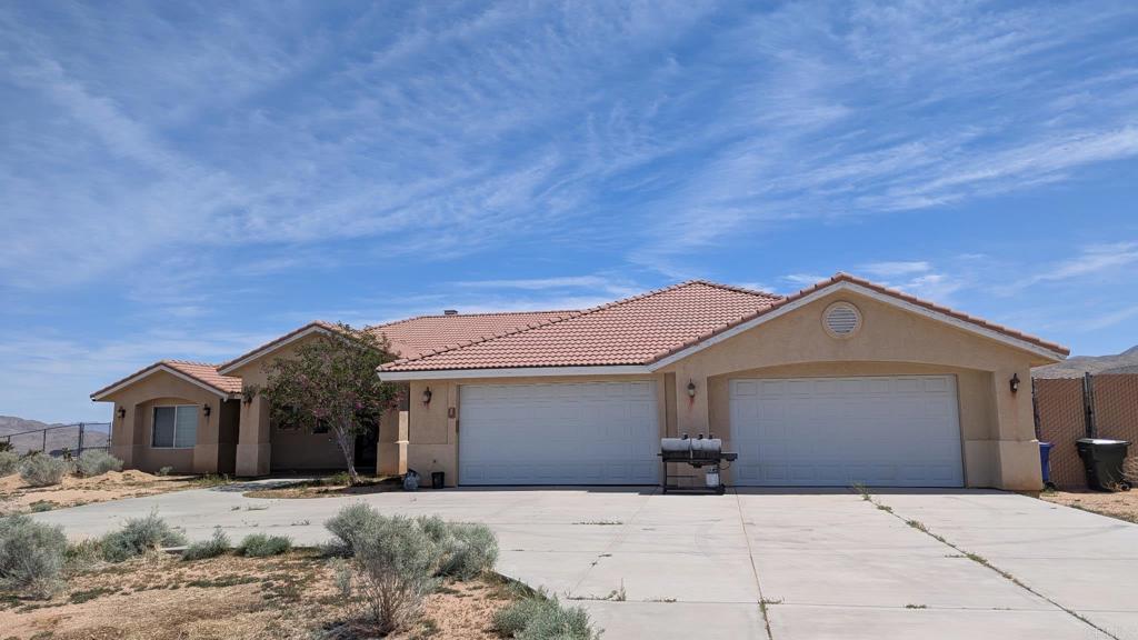 MUST SEE!!! This beautiful home features 4 nice size bedrooms each with it's own bathroom. The master bathroom has a nice sitting area, and a jetted bathtub. Formal dining room with a fireplace. The large family room features a cozy fireplace. The kitchen has stainless steel appliances, granite counter tops and an island. This home also has a 5 burner stove, a double oven and a walk-in pantry. There's a 4 car garage and enough yard space for an RV as well as motorized toys.