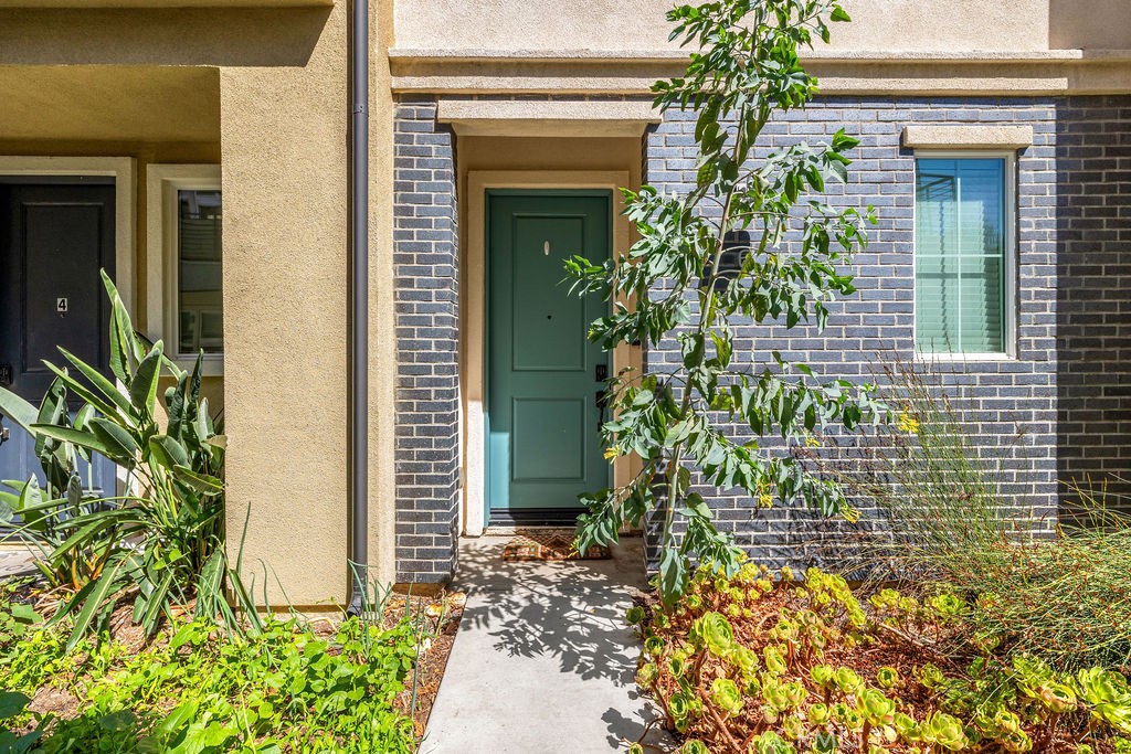 Welcome to 1416 N Harbor Boulevard Unit 6 in the Harborside Collection, a modern townhome community built in 2018 that brings together style, comfort, and convenience in the heart of Santa Ana. This 2bd/2.5ba residence offers a thoughtful layout that feels both open and inviting, beginning with a light filled main level featuring vinyl wood flooring and an open concept design that flows naturally from the living area to the dining space and into the upgraded kitchen. Here you will find quartz countertops, a sleek subway tile backsplash, stainless steel appliances, and crisp cabinetry that create a clean and modern aesthetic while still feeling warm and welcoming. Just off the living space, a private balcony provides the perfect spot for morning coffee or winding down in the evening. Upstairs the primary suite offers a walk in closet and ensuite bath, while the second bedroom and full bath provide flexibility for guests, family, or a home office. A dedicated laundry closet on the upper level keeps everyday chores simple, and a powder room on the main level adds extra convenience when entertaining. The oversized two car garage is a game changer, with direct access, abundant storage, and an EV ready setup, while paid solar panels deliver energy efficiency and long term savings. The Harbor Collection community itself is designed for connection and ease, offering a tot lot for play, a communal barbecue area for gathering, and open green spaces for enjoying the California sunshine. The location is equally appealing, with easy access to the 22, 5, and 405 freeways along with shopping, dining, schools, and parks just minutes away. Adding even more value, the property is located along the planned OC Streetcar corridor, a light rail project currently under construction that will link Santa Ana to Garden Grove and beyond, bringing future transit access and long term growth potential to an already thriving area. With its modern upgrades, smart efficiencies, and central location, this home offers a forward thinking investment and a beautiful place to call home. Opportunities like this do not come along often in such a well connected and growing part of Orange County, especially with the OC Streetcar on the horizon. Whether you are looking for your first home, a low maintenance lifestyle, or an investment property that positions you for the future, this checks every box. Schedule your showing today and experience the perfect blend of comfort, convenience, and community.