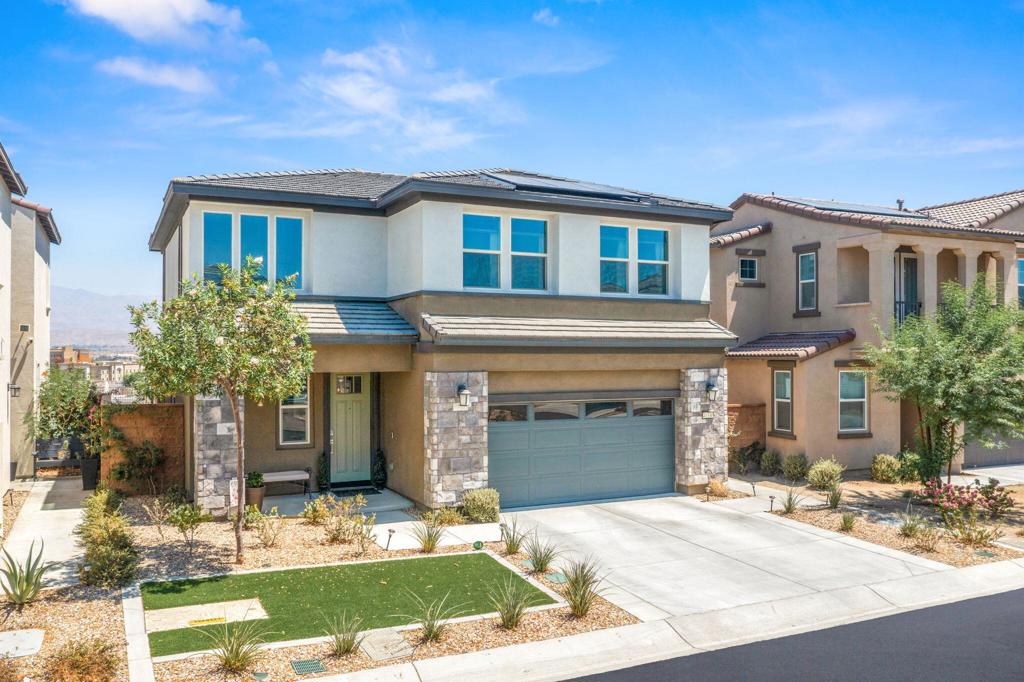 Step into modern desert living at 41330 Harvey Mudd Drive, located in the sought-after University Park community. Built in 2023, this 4-bedroom, 3-bathroom home offers 2,032 sq. ft. of thoughtfully designed living space, enhanced by premium upgrades inside and out.The open-concept great room flows into a chef's kitchen featuring granite countertops, a herringbone backsplash, stainless steel appliances, a double oven, pendant lighting, and a spacious dining area. Large sliding glass doors frame your premium view and open to a covered patio and beautifully landscaped backyard with pet-proof turf, perfect for year-round enjoyment.The flexible floor plan includes a main-level bedroom and full bath, ideal for guests or multi-generational living. Upstairs, the primary suite offers a private retreat with a soaking tub, walk-in shower with Moen rain shower head, dual vanities, and a generous walk-in closet. Additional upgrades include bamboo window coverings, upgraded carpet and tile, designer lighting and ceiling fans, behind-TV electrical outlets, epoxy garage floors, and smart home features like a MyQ garage app, Ring cameras, Schlage code lock, and an alarm system with motion sensors.Enjoy energy efficiency with paid solar, a tankless water heater, and low-maintenance landscaping. As part of University Park, residents enjoy a resort-style pool, spa, recreation center, and low HOA dues of just $144/month.Ideally located near top golf courses, the 1-10 The Living Desert Zoo, and the upscale shops and dining on El Paseo, this home offers both convenience and style.Your dream home with a view awaits, schedule a private tour today!