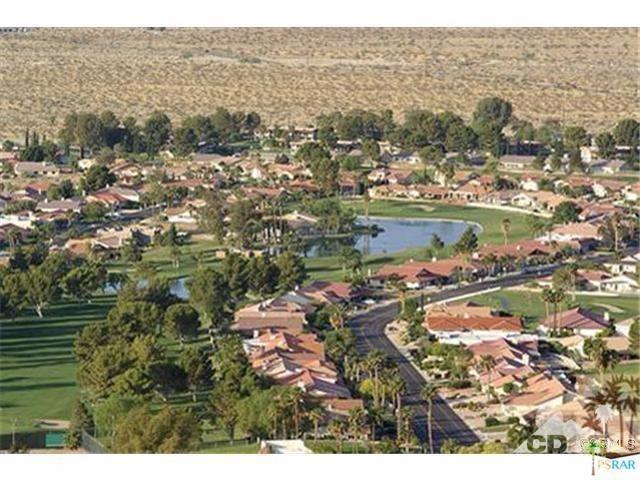 Live in country club style at MISSION LAKES Country Club... Spacious, 1821sf-, 3 bedroom home features FORMAL living,dining rooms,hallway and all 3 bedrooms have wood flooring and a SEPARATE family room./or dining. DOUBLE sided FIREPLACE, JETTED spa tub in master bedroom, CEILING fans, LARGE private yard with citrus trees. Immaculate and located on a cul-de-sac with MOUNTAIN and GREENS views. LARGE 3 car garage with lots of driveway parking. Enjoy community pool, spas, and tennis w/ a small fee by Country Club. ONSTIE bar and RESTAURANT, and PRO shop.Don't forget 18 hole TED ROBINSON designed GOLF course... What are you waiting for, ENJOY the WONDERFUL country club life.