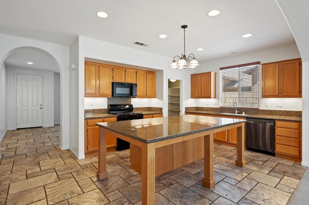 Beautifully Upgraded 4-Bedroom Home in the Resort-Style Gated Community of Terra Lago. Spacious and stylish two-story home, located in the highly sought-after, guard-gated community of Terra Lago in North Indio. Known for its 20-acre lake, dramatic mountain views, and resort-quality amenities, Terra Lago offers the perfect balance of serenity and sophistication. This residence has been thoughtfully updated and is move-in ready. Freshly painted interiors, brand-new carpet, and upgraded appliances--including a new microwave, range, and stove--complement the comfort of two newer A/C units. Interior Highlights include elegant travertine stone flooring throughout the main level, an expansive kitchen with granite countertops, oversized island, walk-in pantry, and abundant cabinetry--ideal for entertaining. Flexible front room, perfect as a dining space, home office, or den. Primary suite located on the first floor for enhanced privacy. Three upstairs bedrooms, each with ceiling fans and easy access to a double-sink full bathroom. Dedicated laundry room with ample built-in storage. Private two-car garage with additional storage and a freshly painted driveway. Low-maintenance front patio and backyard designed for relaxation or gatherings. Community Amenities (Exclusive to Residents) include guard-gated entry with 24-hour security and roving patrol plus a resort-style pool, fitness center, and clubhouse with event room, billiards, ping-pong, and children's play nook, scenic 20-acre lake for boating, canoeing, and evening strolls, lush greenbelts, BBQ areas, playgrounds, and open spaces. Convenient access to golf, shopping, dining, schools, and the I-10 freeway. Lease Includes: Frontier high-speed 500/500 Mbps internet, DIRECTV package, trash, and landscaping services.