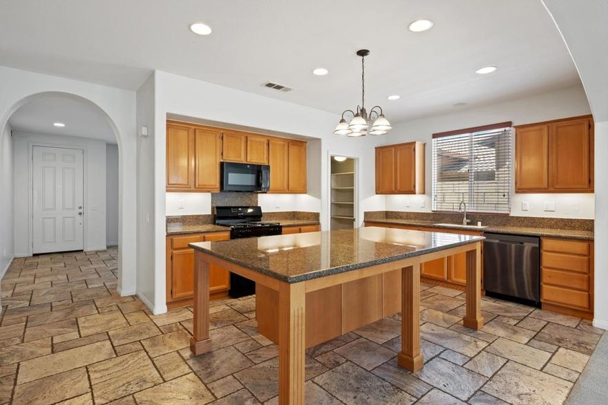 Beautifully Upgraded 4-Bedroom Home in the Resort-Style Gated Community of Terra Lago. Spacious and stylish two-story home, located in the highly sought-after, guard-gated community of Terra Lago in North Indio. Known for its 20-acre lake, dramatic mountain views, and resort-quality amenities, Terra Lago offers the perfect balance of serenity and sophistication. This residence has been thoughtfully updated and is move-in ready. Freshly painted interiors, brand-new carpet, and upgraded appliances--including a new microwave, range, and stove--complement the comfort of two newer A/C units. Interior Highlights include elegant travertine stone flooring throughout the main level, an expansive kitchen with granite countertops, oversized island, walk-in pantry, and abundant cabinetry--ideal for entertaining. Flexible front room, perfect as a dining space, home office, or den. Primary suite located on the first floor for enhanced privacy. Three upstairs bedrooms, each with ceiling fans and easy access to a double-sink full bathroom. Dedicated laundry room with ample built-in storage. Private two-car garage with additional storage and a freshly painted driveway. Low-maintenance front patio and backyard designed for relaxation or gatherings. Community Amenities (Exclusive to Residents) include guard-gated entry with 24-hour security and roving patrol plus a resort-style pool, fitness center, and clubhouse with event room, billiards, ping-pong, and children's play nook, scenic 20-acre lake for boating, canoeing, and evening strolls, lush greenbelts, BBQ areas, playgrounds, and open spaces. Convenient access to golf, shopping, dining, schools, and the I-10 freeway. Lease Includes: Frontier high-speed 500/500 Mbps internet, DIRECTV package, trash, and landscaping services.