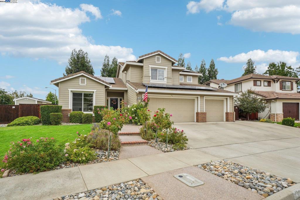Impressive and full of upgrades! This 1999-built home sits on a large corner lot. Inside, enjoy vaulted ceilings, abundant natural light, and a spacious kitchen with cement counters and a rustic island. Complemented by stylish flooring and new carpet. The floor plan includes a downstairs bedroom with an updated, charming full bath—perfect for guests. Step outside to a covered pergola, beautifully landscaped yards with faux lawn, a sparkling pool with safety gate, and a shed right off the pool—your very own clubhouse! 3-car garage, generous side yard access for extra storage, 4 sheds, and even a chicken coop. Solar panels with 2 battery backups. There is so much more to complete this rare blend of beautiful comfort, function, and fun. Located in South Livermore, this home offers the best of Livermore living while providing a gorgeous space to call your own.