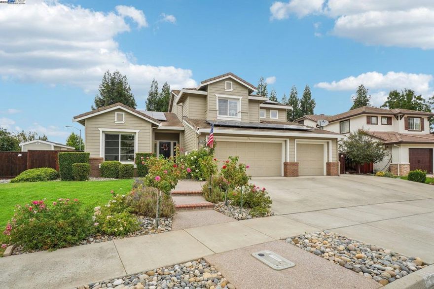 Impressive and full of upgrades! This 1999-built home sits on a large corner lot.  Inside, enjoy vaulted ceilings, abundant natural light, and a spacious kitchen with cement counters and a rustic island. Complemented by stylish flooring and new carpet. The floor plan includes a downstairs bedroom with an updated, charming full bath—perfect for guests. Step outside to a covered pergola, beautifully landscaped yards with faux lawn, a sparkling pool with safety gate, and a shed right off the pool—your very own clubhouse! 3-car garage, generous side yard access for extra storage, 4 sheds, and even a chicken coop. Solar panels with 2 battery backups.  There is so much more to complete this rare blend of beautiful comfort, function, and fun. Located in South Livermore, this home offers the best of Livermore living while providing a gorgeous space to call your own.