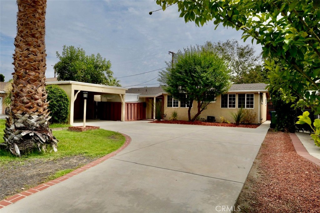 Charming Single-Story Home with Spacious Yard. Welcome to this pristine single-story home offering 3 bedrooms, 2 bathrooms, plus a versatile den with a closet that can serve as a 4th bedroom. Bursting with character, the home features soaring wood-beamed ceilings and an open, airy layout.
The bright kitchen overlooks the expansive backyard, perfect for both relaxation and entertaining. Step outside to enjoy the covered patio, outdoor storage, and generous yard space. Parking is not an issue with the attached 2-car carport, long driveway, and ample street parking.
Inside, you’ll find two full bathrooms, making this an excellent choice for a large or growing family. Ideally located near the Winnetka Recreation Center and close to shopping, dining, and schools, this property combines convenience with comfort.
Move-in ready and full of potential—this is a wonderful opportunity you won’t want to miss!