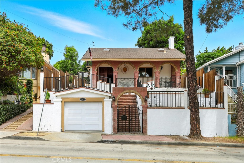 Welcome to this charming 4 bedroom & 3 bathroom home with a 3 car detached garage, located close to Uptown Whittier & Whittier College with lots of character.
As one passes through the ground level front archway & climb up the stairway to your heavenly home, one will arrive at a fork in the stairway to the front porch with
multiple arches. You can go left or right to enter the front porch. On the right, there is a nice patio area with a table & chairs to enjoy your mornings and evenings.
Front double door has been beautifully designed & exquisitely stained to please the eye. Once inside, one will notice the open & spacious floor plan with vaulted ceiling, laminated wood floorings, crown molding & ceiling fans, smooth ceilings, & newly painted throughout the home to give that extra personal touch. To the left is a dry bar & the formal dining area with entryway to the kitchen. To the right is a spiral stairway to upstairs & living room area with a modern fireplace, mantel & accented tiled wall to give that extra elegance, & a door to your first level, good sized, master bedroom & bathroom. There is also a half bathroom downstairs. The kitchen boasts vaulted ceilings, sunroof, & granite countertops, backsplash all the way up to the cabinets with soft close drawers & doors. Laundry room is strategically placed on the right side as one enters the kitchen behind cabinet doors so as not to be seen unless it is in use.
There are 3 bedrooms & 1 bathroom upstairs, all with vaulted ceilings to give a spacious feel. Two of the bedrooms has balconies with a peek a boo view of the city and hills to enjoy those breezy nights. .
Portion of the back yard is nicely concreted & pavered so can park multiple cars. The 2 car garage at back of home is spacious and above the garage is a Rooftop Terrace with built in BBQ, great for entertaining families, friends & guests. To enter the RoofTop Terrace, one enters the last archway to more back yard space, large enough to add a pool if desired. To the left side of the home at ground level, there is also a 1 car garage and above it is a elevated yard. Perfect to put in artificial grass to give it the garden look. Right side also have 3 elevated yards, the top one being the patio area in front of the porch, the middle one is currently a garden, & the first one could be used for a garden as well or use it for whatever imagination that comes to one's mind during Halloween or Christmas times.