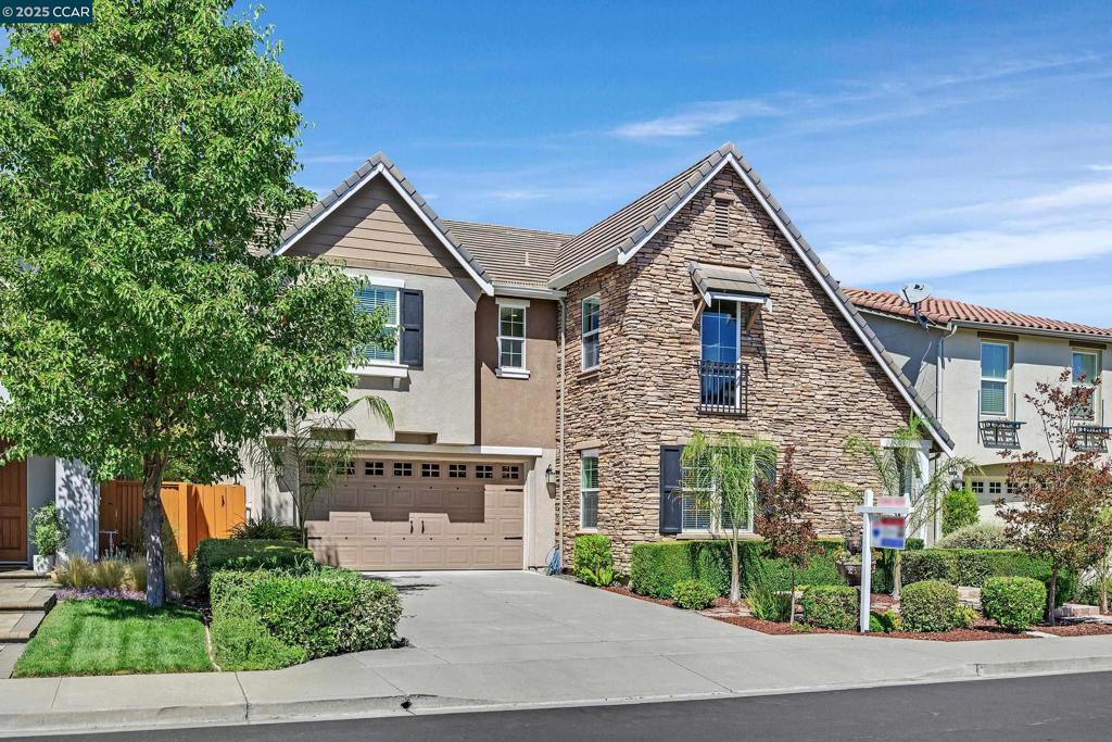 Nestled in Danville’s prestigious Monterosso neighborhood, this beautiful North facing home with a long driveway & superior curb presence, blends luxury with comfort. Thoughtfully upgraded aprox. 3,000 sq ft, 5 sun soaked bedrooms and 4.5 elegant baths with a convenient main-level ensuite bedroom and a powder bath for guests. From the moment you step in through the imposing double door entry, rich hardwood floors, wrought iron stairway and recessed lighting set an upscale tone. Formal dining room with a designer chandelier and a formal living room provide added space for elegant gatherings. The heart of the home is the chef’s dream kitchen, with ss appliances, gas cooktop, island, breakfast area and tranquil views of the lush backyard. Open to the kitchen, the inviting family room offers a cozy fireplace perfect for relaxing or entertaining. Upstairs, a secondary loft area offers flexibility for media, play, or study space. The expansive primary suite is a private retreat, featuring a walk-in closet and a spa-like bath with dual vanities, a soaking tub, and walk in closet. Step out into your personal backyard oasis the perfect setting for family barbecues, evening cocktails or enjoying California sun. Located near top-rated schools, shopping, Blackhawk Plaza. BEST VALUE!