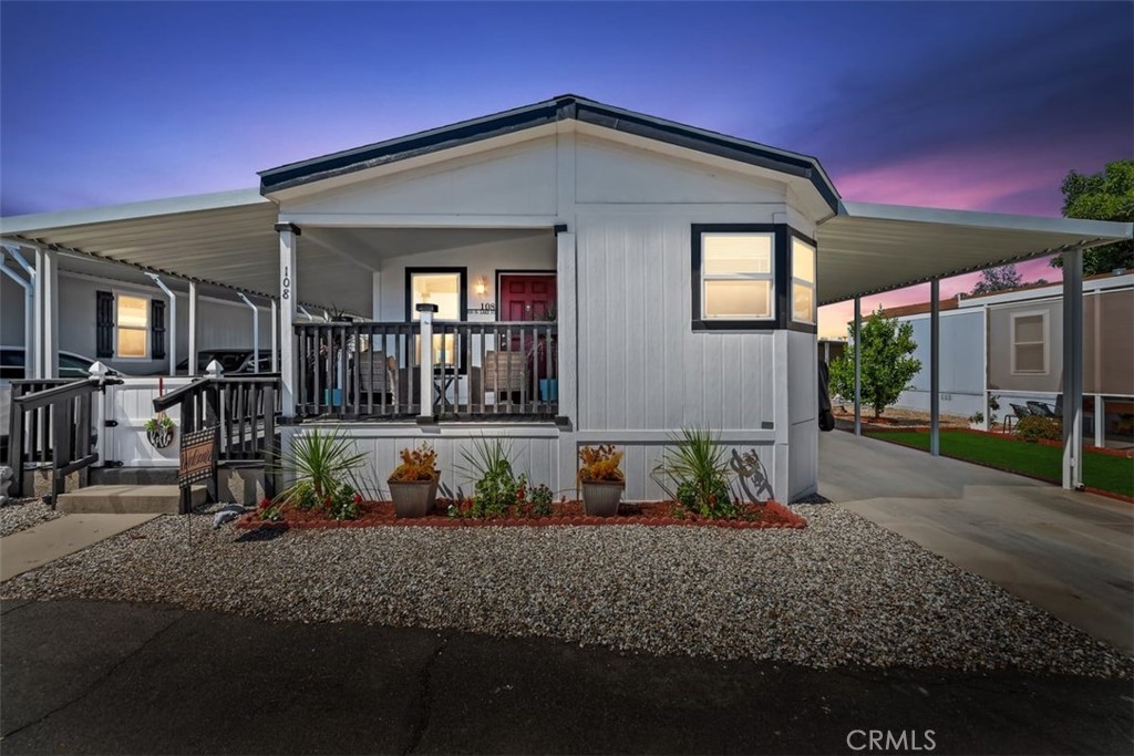 PRICE IMPROVEMENT. SELLER IS EAGER FOR A QUICK SALE! FARMHOUSE CHIC WITH ALL THE BELLS AND WHISTLES! BEAUTIFUL 2022 HOME WITH 2 BEDROOMS AND A LARGE BONUS ROOM WHICH CAN BE USED AS A DEN/OFFICE OR BEDROOM (NO CLOSET). THE HOME HAS LUXURY VINYL PLANK FLOORING AND NEW FIXTURES. BEDROOMS INCLUDE CEILING FANS AND CARPET. THE NATURAL LIGHT FILLED MASTER BEDROOM HAS AN EN SUITE WITH A DOUBLE SINK VANITY, WALK-IN SHOWER AND LARGE WALK-IN CLOSET. THE UPGRADED KITCHEN HAS UNDERLIT CABINETS, LARGE BLACK ONYX FARMHOUSE SINK, PANTRY WITH ETCHED GLASS DOOR, STAINLESS STEEL APPLIANCES AND RECESSED LIGHTS. SPECTACULAR SCENIC MOUNTAIN VIEWS CAN BE SEEN FROM THE KITCHEN WINDOWS. A LARGE INSIDE LAUNDRY ROOM WITH LIKE NEW WASHER AND DRYER ARE INCLUDED. BARN DOORS ARE ALSO FEATURED IN THE HALL BATH AND GUEST BEDROOM. THE EXTERIOR OF THE HOME HAS A COVERED FRONT PORCH AND A SIDE COVERED CONCRETE DECK FOR ENJOYING SUMMER EVENINGS IN YOUR ROCKING CHAIR. A LARGE SHED FOR STORAGE AND AN ENCLOSED AREA PERFECT FOR PETS IS ALSO ON THE PROPERTY. THE PARK'S AMENITIES INCLUDE POOL, SPA, FITNESS ROOM, BILLIARD ROOM AND CLUBHOUSE. THIS IS A SAFE AND FRIENDLY GATED COMMUNITY NEAR SHOPS, RESTAURANTS AND CASINO.