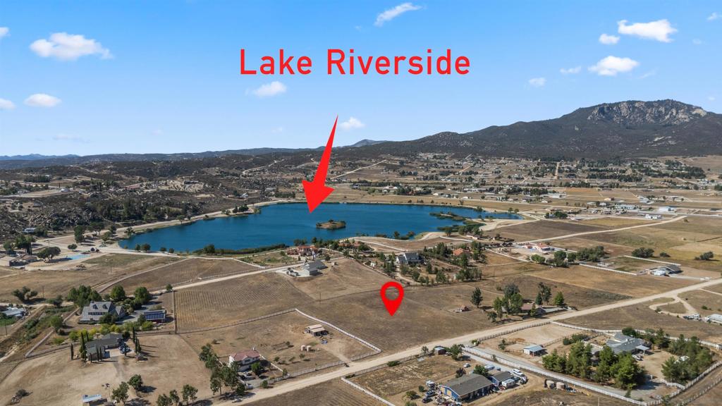 Lot 342 on Indian Hill Trail offers 2.57 acres of raw land with freshly cut grass, just 100 meters from the beautiful Riverside Lake. Nestled in a gated community with panoramic mountain views, this property provides endless opportunities for building your dream home, guest house, barn, or space for RVs, trailers, toys, and even horses. Conveniently located just one street from the paved entrance road, it offers both privacy and accessibility, with the added peace of mind of a CalFire station within the community. Residents enjoy an array of amenities including a private lake with boat dock, a horse arena, pool, basketball and volleyball courts, pump bike track, playground, private airstrip, and miles of scenic hiking and riding trails. All of this is just 25 minutes from the vibrant city of Temecula, known for its award-winning wineries, fine dining, and entertainment, making this property the perfect balance of country tranquility and modern convenience.
