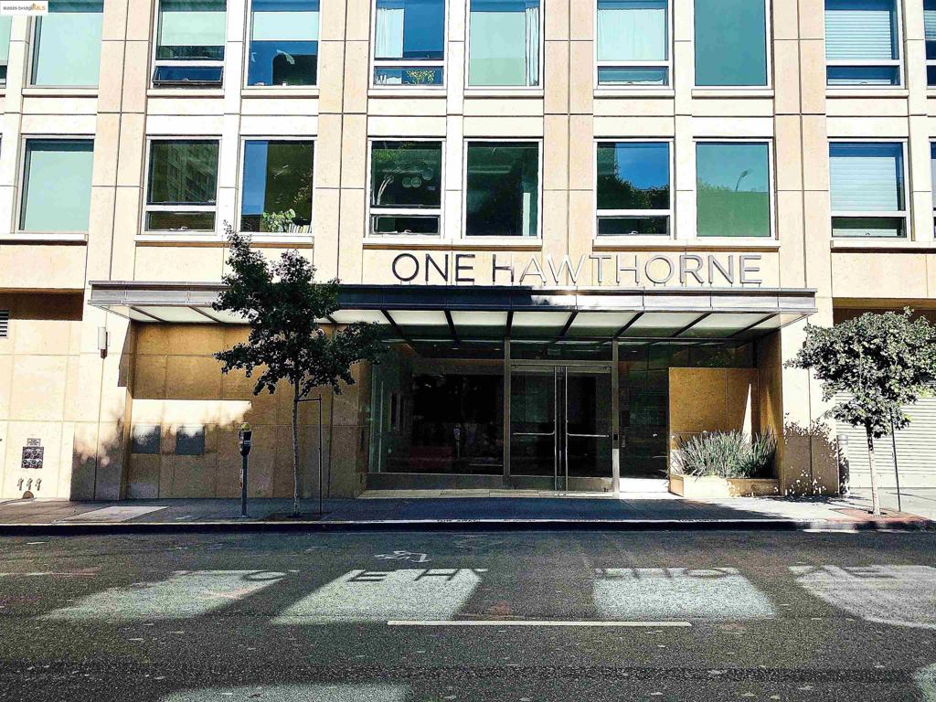 Fantastic Opportunity to own a beautiful unit at One Hawthorne- a landmark condominium building centrally located in downtown San Francisco at Hawthorne and Howard Streets. 14c is a premium 2 bedroom, 2 bathroom condo with dramatic cityscape & sunset views of the San Francisco. The floor plan is spacious with plenty of light. Premium-grade finishes are the hallmark of this wonderful home which includes a modern chef's kitchen, two luxurious full bathrooms , beautiful hardwood flooring and carpet, and designer fixtures. Additional conveniences include a bonus room, closet organizers, an in-unit washer/dryer (included), and central air and heating. Building amenities include a fitness center, doorman, & a stunning roof deck with BBQ area with panoramic views. The building has 24 hour front desk attendance in the lobby, valet parking with electric vehicle charging stations, 26th floor panoramic roof access, and exercise and fitness room.