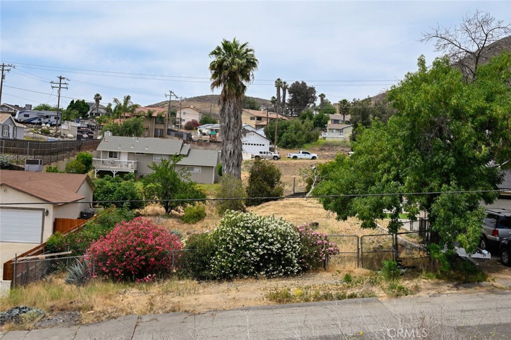 Now available in Canyon Lake — this 9,147 sq ft parcel offers a versatile development opportunity in a peaceful residential setting. Nestled on a gentle slope with surrounding hillside views, the lot provides ample space and flexibility for a custom build or investment project. The neighborhood showcases a mix of established homes and newer construction, making it an appealing option for builders or buyers looking to create something unique. Utilities are nearby, and the lot is easily accessible via paved roads. Conveniently located near schools, parks, shopping, and dining, with easy access to major highways. A rare chance to own land in a growing area — bring your vision and explore the possibilities. Buyer to verify all information including zoning, utility access, and potential use.