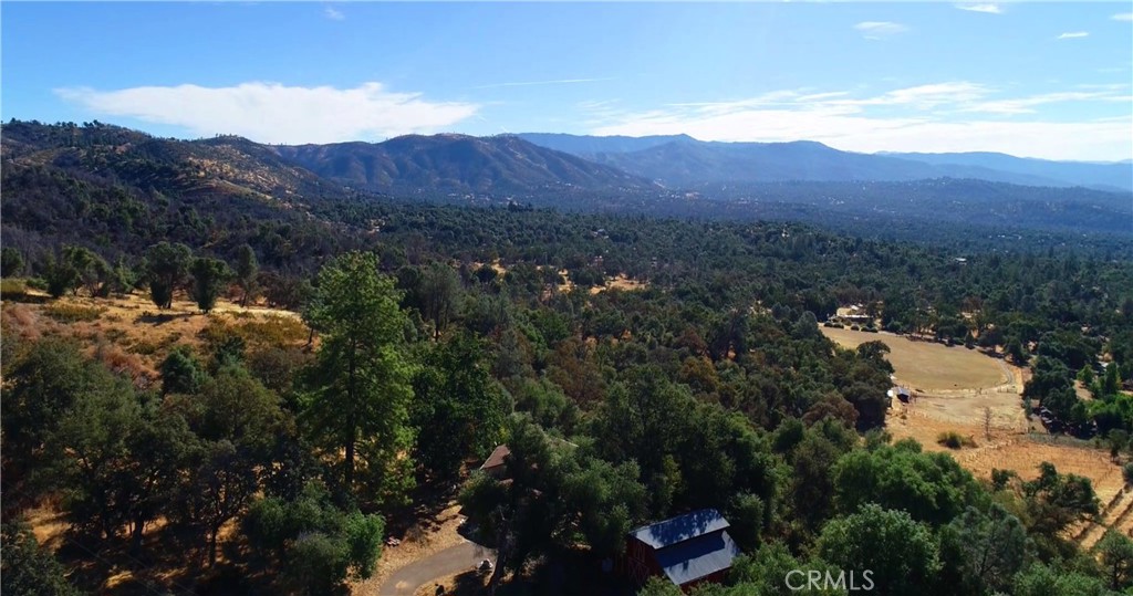 Bring Your Cash! Double Fixer Upper with Incredible Views. Two Homes on 5+ acres! Main home is a 2/2 with 1,416 sq. ft. of living space; a 672 sq. ft. attached garage & just off the living/dining/ kitchen area is 320 sq. ft. balcony overlooking the Beauty & Splendor of all God's creation. Manufactured home is also a 2/2; it has 1,152 sq. ft. of living space; the interior renovation on this unit has already begun & most of the old amenities have already been tossed out. The 960 sq. ft. Red Barn adds much to the curb appeal as well as being completely functional. Both homes & the barn could use some cleanup & TLC, but the person that restores this property back to her former glory will really have something to show for their labors. To be sold "As-Is, as Disclosed". Cash or hard money loans only; Seller will not pay for any inspections or repairs so it is doubtful any conventional financing would be available.