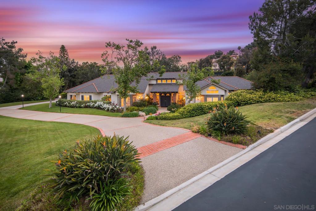 Effortlessly chic and unapologetically inviting. This single-level French Country stunner sits on a prime corner lot in the prestigious 24-hour guard-gated enclave of Fairbanks Ranch—one of Rancho Santa Fe’s most coveted communities. From the moment you roll into the circular driveway, the curated landscape and timeless architecture set the tone for something special. Inside, vaulted open-beam ceilings, wide-plank hardwood floors, and sun-drenched rooms deliver a laid-back sophistication. Nearly every space spills effortlessly into the backyard through classic French doors, blurring the line between indoors and out. Picture a black-bottom pool (heats up naturally or on-demand), bubbling spa, built-in BBQ, bocce ball, raised garden beds, chipping green, and total privacy—all wrapped in lush, estate-style grounds. The chef’s kitchen is all muscle and charm with a 6-burner Viking cooktop, industrial-grade hood, griddle, 3 ovens, a prep island, and pantry. Whether you’re entertaining or just making breakfast, it flows seamlessly into the family room and outdoor living space. There are three fireplaces throughout the home—including in the dreamy primary suite, where you can unwind in the soaking tub with garden views or curl up fireside with your latest read. And when it’s time to venture out, you’re just a short stroll to the lake, clubhouse, tennis courts, and trails. Fairbanks Ranch also offers an equestrian center and direct access to Solana Santa Fe Elementary. 6195 Avenida Picacho Where elegance meets everyday ease—and the good life begins. Fully furnished, Owner pays HOA, pool service, landscape maintenance and water bill.