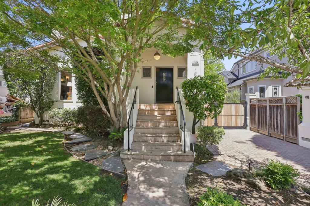 Welcome to 2404 Hillside Drive, a beautifully Mediterranean gem in Burlingames coveted Easton Addition. This elegant 4BD/4BA home offers nearly 3,000 sq ft of refined living space with timeless charm and modern comforts. The light-filled formal living and dining rooms feature soaring ceilings, hardwood floors, and a wood-burning fireplace with vintage tile surround. The updated kitchen boasts a gas range, built-in pantry, and breakfast nook, flowing into a cozy family areaperfect for everyday living. Three bedrooms are located upstairs, while a versatile lower-level suite with private entry offers ideal space for guests, a home office, or in-laws. Skylit bathrooms feature double vanities and tasteful finishes. Step outside to a private backyard oasis with built-in BBQ, fire pit, stone patios, and artificial turfperfect for entertaining. A gated driveway and detached 2-car garage complete the home. Classic details and proximity to top schools and downtown Burlingame make this home a rare find. Experience the perfect blend of character, comfort, and convenience at 2404 Hillside Drive.