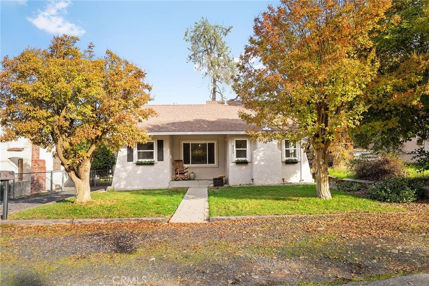 This charming 2 bedroom, 1 bathroom home feels warm, inviting, and ready for you to move right in. The moment you step inside, you’ll be greeted by an abundance of windows that let natural light pour in. The cozy living room offers the perfect place to unwind. The  kitchen has durable tile countertops, stainless steel appliances, and a gas range that will make meal prep a breeze.  Nearby, the dedicated dining area provides a comfortable space to gather and connect. Both bedrooms are generously sized, and have small walk in closets. Additional amenities include an indoor laundry room for added convenience that doubles as a mudroom and offers the perfect transition space from the outdoors to the interior. Outside, you’ll find a detached 1-car garage and a spacious backyard that’s ideal for outdoor entertaining, gardening, or simply relaxing in the fresh air. Filled with charm and practical features, this adorable property is ready to welcome its next owners. Come make this delightful house your new home!