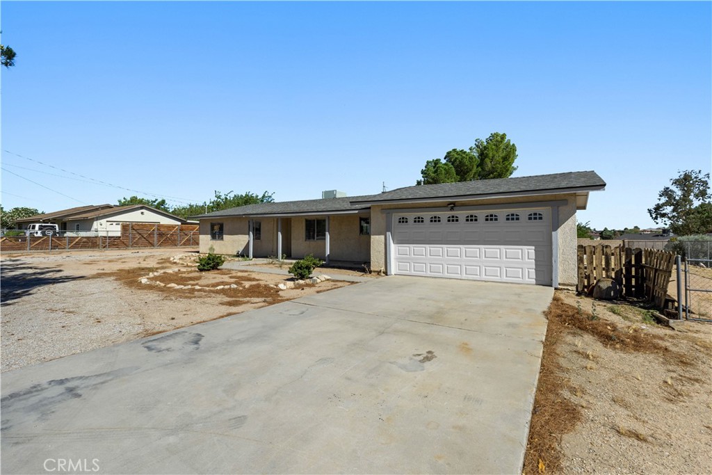 Welcome to this beautifully updated home on nearly a half-acre! Inside, the open floor plan is anchored by a cozy wood-burning stove fireplace insert in the living room. The kitchen is a true highlight with granite counters, a stylish new backsplash, and a breakfast bar perfect for casual dining or entertaining.
The upgraded bathrooms feature gorgeous tile showers and granite counters, adding a touch of elegance throughout. The home also boasts durable tile flooring in every room, combining style with low-maintenance living.
Outside, the property is cross-fenced for versatility, while the impressive RV garage doubles as a workshop, offering plenty of space for hobbies, projects, or storage. With modern upgrades, thoughtful details, and room to spread out, this home blends comfort, functionality, and charm all in one.