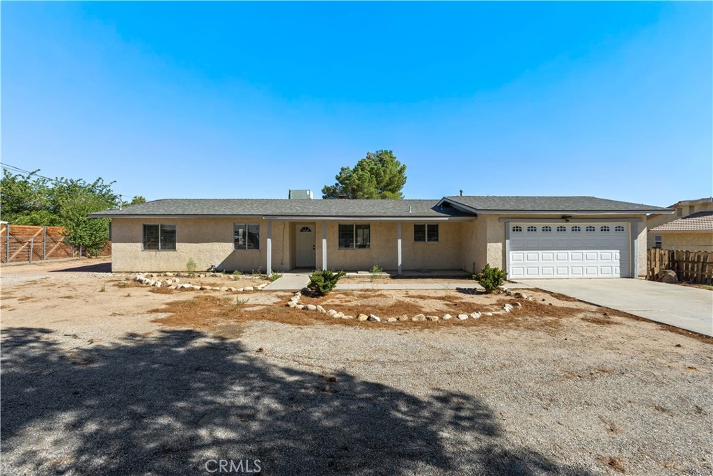 Welcome to this beautifully updated home on nearly a half-acre! Inside, the open floor plan is anchored by a cozy wood-burning stove fireplace insert in the living room. The kitchen is a true highlight with granite counters, a stylish new backsplash, and a breakfast bar perfect for casual dining or entertaining.
The upgraded bathrooms feature gorgeous tile showers and granite counters, adding a touch of elegance throughout. The home also boasts durable tile flooring in every room, combining style with low-maintenance living.
Outside, the property is cross-fenced for versatility, while the impressive RV garage doubles as a workshop, offering plenty of space for hobbies, projects, or storage. With modern upgrades, thoughtful details, and room to spread out, this home blends comfort, functionality, and charm all in one.
