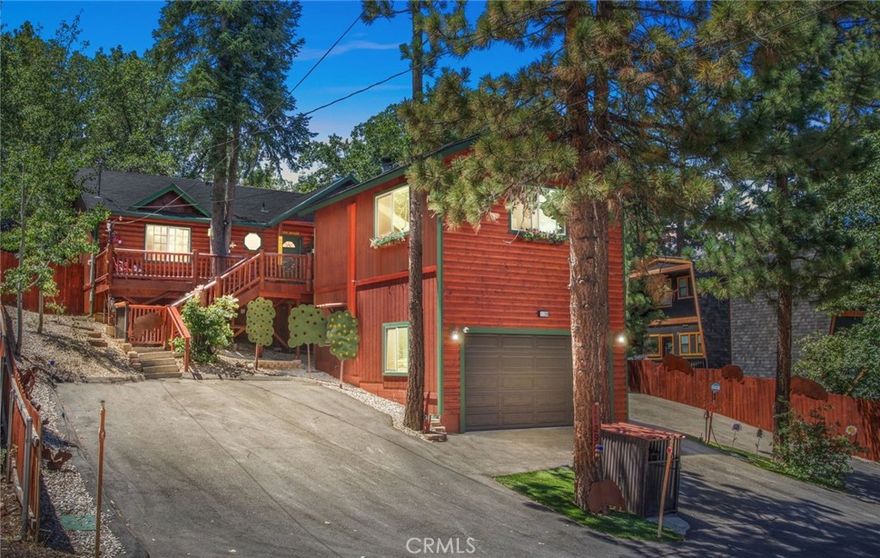 Beautifully Upgraded Moonridge Retreat! Set on a private, well treed lot with lake and mountain views, this meticulously maintained property blends relaxation and style. The main home offers a convenient ranch style layout with wood lined vaulted ceilings in the main room, 2 bedrooms and 2 baths, including a spacious master suite. Notable upgrades include new flooring throughout, mini splits for added comfort, an open remodeled kitchen that features granite countertops, freshly painted cabinets and stainless steel appliances. Bathrooms are beautifully updated with marble counters and modernized vanities. A rare find, the newly added detached guest suite adds a third bedroom, third bath, and 480 sq ft of additional living space, along with an oversized garage below that includes an EV charger. Outdoors, enjoy extensive landscaping, a putting green, and multiple decks for entertaining or relaxing. Also includes an oversized shed with ample room for storage. Don't miss this one...pride of ownership is evident in every detail!