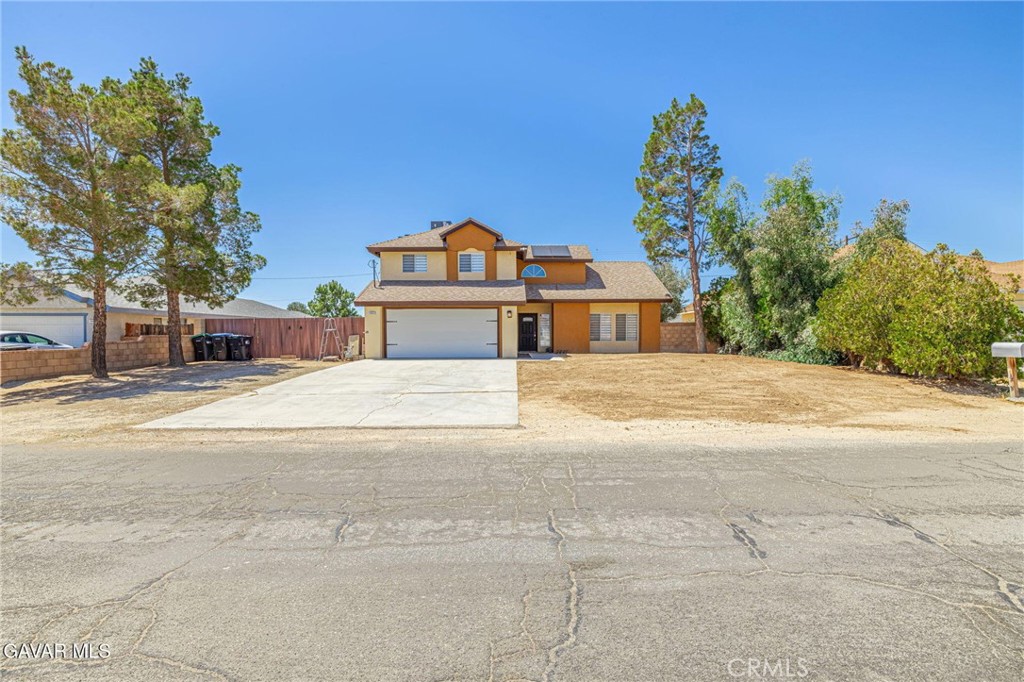 Welcome to this Beautiful 2 story California City home. Situated on the North Loop side. Walk into your new home consisting of a beautiful tiger bamboo floors. High vaulted ceilings in the family room area. Separate living area with a wonderful fireplace. Upgraded kitchen with granite countertops and custom cabinets. Downstairs bedroom/office alongside a bathroom with a shower. Upstairs is the master bedroom with a walk in closet. Master bathroom has dual sinks and a jetted tub. 2 more bedrooms that are connected but can be their own separate rooms again. Big size backyard with RV access and plenty of parking located on a quiet street. Come see before it's gone.