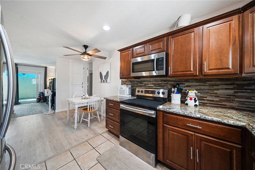 Welcome to Monterey Cypress, a gated community near historic downtown Escondido. This upgraded ground-floor condo features 2 bedrooms and 2 full bathrooms in a thoughtful layout that offers both comfort and functionality.
The remodeled kitchen shines with modern cabinetry, sleek granite countertops, and high-end stainless steel appliances. New windows throughout fill the home with natural light, complementing the durable tile and vinyl flooring. The spacious living area flows easily to a private covered porch—ideal for morning coffee or evening relaxation.
This unit includes a covered parking space, with the option to lease a second space. Conveniently located near the community pool, you’ll also enjoy the benefits of a gated setting. HOA fees cover water, sewer, and trash, adding to the ease of living.
With shopping, dining, and freeway access just minutes away—and local attractions like Kit Carson Park, Lake Hodges, and the San Diego Zoo Safari Park nearby—this home offers the perfect balance of modern upgrades, convenience, and community.