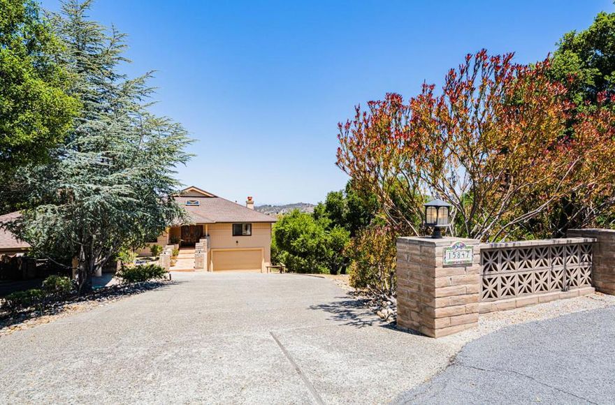 Wow check this price out for this home....Feel like you're on vacation everyday, views from almost every room.  Spectacular SINGLE story 3-bed, 2-bath single story home PLUS a  1 bed/bath attached guest or in-law quarters.  MAIN house has 3,347 SF, GUEST AREA 739 SF 1-bed, 1-bath in-law unit with private easy entrance, (no stairs)  patio & parking. Built by Nivlac Construction Inc. for the builder himself . Substantially updated main house with chefs kitchen, wood and stone floors, and sweeping views of the San Benancio Hills and beyond from nearly every room. Grand entry opens to a spacious living room, dining area, and family room with beautiful vaulted ceilings,  all centered around warmth and comfort with 3 fireplaces throughout. Bonus 450 SF loft, offers flexible use. Primary bedroom has vaulted ceilings with a gorgeous primary bath sanctuary.  Multiple patios off the kitchen for effortless indoor-outdoor entertaining. Massive 950 SF garage with workshop area, room for toys, hobbies & storage. Set on 3.5+ acres.Wildfire Prepared Certified Property, Certification may allow buyer to obtain traditonal insurance.  Plenty of parking & storage. Homeowners Association for water and roads.  This home is a such a pleasure to show!