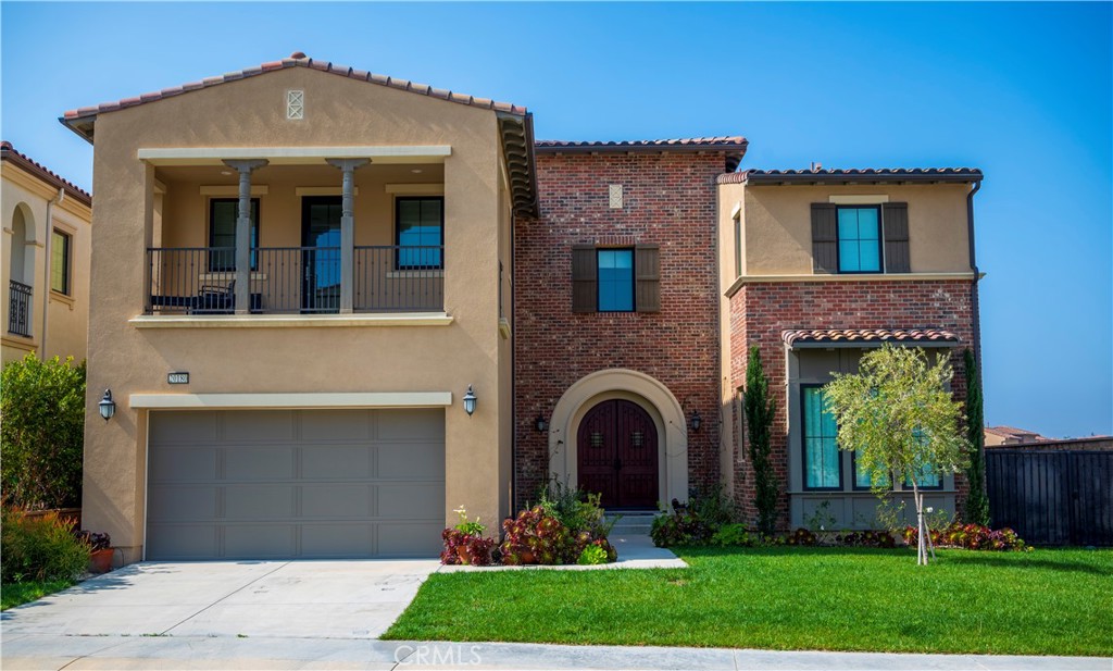 This energy-efficient, solar-equipped corner-unit home is located in the highly sought-after, prestigious, guard-gated Westcliffe community of Porter Ranch. The main level features an office and a formal dining room, complemented by multi-panel stacking glass doors that seamlessly connect the living spaces to the California-style covered patio in the backyard, and side yard. The gourmet kitchen is a chef's delight, equipped with a sizable center island, upgraded white quartz countertops, beautiful kitchen cabinets, and top-of-the-line KitchenAid stainless-steel appliances. Upstairs, discover a spacious loft alongside the master suite and three additional bedrooms, each with its private bathroom. One of the bedrooms even features a generous-sized balcony. The master bedroom offers a peek-a-boo view and a luxurious en-suite bathroom with a walk-in closet, a spacious shower, a free-standing tub, and two separate vanities. The laundry room conveniently located on the second floor. The property also includes a 3-car attached garage.