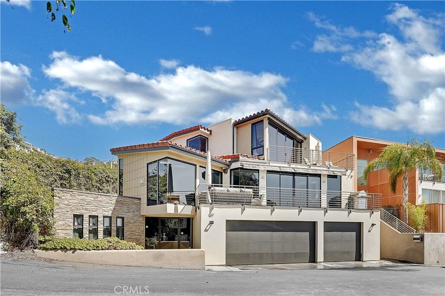 Gorgeous ocean views and easy access to iconic Victoria Beach from this completely remodeled contemporary home! Purposefully designed, all areas of the home have been brilliantly thought out to maximize each space. The entry level main floor features a private bedroom (or office) with a full bathroom and spa like steam room. The mid level welcomes guests into an ocean view gourmet kitchen, dining room, living room and guest bedroom equipped with a full bath & powder room. The walk out deck and fireplace complete this level of the home by tying in a warm, cozy feeling with luxury living. Guests can find the ocean view master suite complete with a King sized bed, over sized walk in closet, soaking bathtub, dual head shower, fireplace and private ocean view deck. One more bedroom on the top floor with custom en-suite bathroom completes this level, and just 5 minutes walking distance to Victoria Beach, this 4 bedroom, 4 bathroom home has everything you could want and more! Washer/dryer and extra refrigerator are located in the spacious 3 car garage adjoined by several parking spots in front of the home to welcome guest parking. This is the beach home you have been looking for!