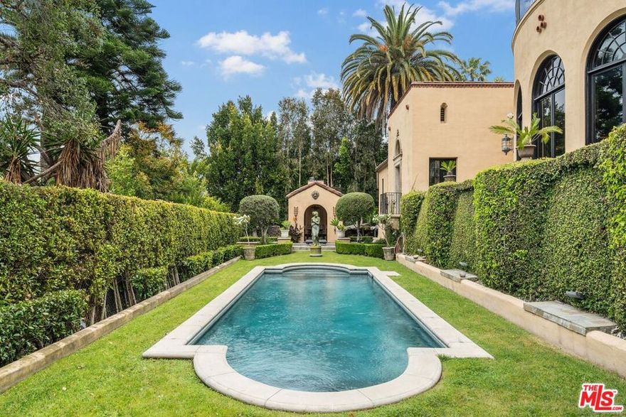 Introducing The Cedars, one of the most architecturally significant and emotionally resonant estates in Los Angeles, a once in a generation offering that transcends traditional real estate and enters the realm of art, history, and legacy ownership. Set high in the historic hills of Los Feliz, The Cedars is an extraordinary Old Hollywood estate originally conceived in the 1920s by acclaimed French film director Maurice Tourneur, a pioneer of early cinema whose vision helped shape Hollywood's golden age. Inspired by the grandeur and romance of the Duke of Alba's villa in Spain, this monumental residence was designed as a private sanctuary for artists, visionaries, and cultural icons. Today, it stands as one of the most distinctive and recognizable estates in Los Angeles. Lovingly and meticulously restored over a three year period by legendary fashion designer Sue Wong, The Cedars has been revived with extraordinary reverence for its original spirit while elevating it to museum quality standards rarely seen in residential property. Every detail was approached as an act of preservation, artistry, and storytelling, guided by Wong's deep understanding of historical design, craftsmanship, and theatrical beauty.From the moment one arrives at the gated motor court, the estate announces itself as something truly special. The commanding facade, monumental arched entry, sculptural stonework, and dramatic proportions immediately evoke the romance of a European villa transported to the heart of Los Angeles. Mature landscaping, terraces, fountains, and magical gardens surround the property, creating a sense of privacy and timeless serenity.Inside, The Cedars unfolds as a richly layered visual and emotional experience. The interiors are defined by soaring ceilings, hand gilded bas relief ornamentation, frescoed arches, carved stone details, stained glass windows, dramatic staircases, and ironwork crafted by master artisans. Gilded ceilings shimmer with old world splendor. Walls are adorned with museum worthy art and period elements sourced from across Europe and North Africa. Each space feels cinematic, intimate, and grand all at once.The main residence is complemented by a beautifully appointed detached guest house, ideal for guests, creatives, or private retreat use. Throughout the estate, rooms flow seamlessly into one another while maintaining distinct character and purpose, offering endless opportunities for entertaining, creative expression, and quiet reflection.The Cedars is legendary not only for its architecture but for the extraordinary lives lived within its walls. Over the decades, it has been home to and frequented by some of the most influential figures in entertainment and culture, including Norma Talmadge, Howard Hughes, Marilyn Monroe, Jimi Hendrix, Johnny Depp, and countless other artists and musicians. It is widely believed that Hendrix composed portions of Purple Haze here, and that the estate served as a gathering place for icons such as Bob Dylan and The Rolling Stones. Few homes in Los Angeles can claim such authentic creative provenance.Sue Wong's stewardship elevated The Cedars to its current status as a living work of art. European artisans were brought in to restore original elements and recreate lost details using traditional methods. Rare antiques were sourced globally to harmonize with the estate's architecture, blending Baroque, Empire, French Art Deco, Moroccan, Andalusian, and Old Hollywood influences into a cohesive and breathtaking whole.Today, The Cedars is not simply a residence. It is a landmark estate, a cultural artifact, and a deeply emotional property that resonates with those who value authenticity, beauty, and legacy. It offers sweeping views over Los Angeles, from city lights to distant horizons, while remaining moments from Griffith Park, the Observatory, and the cultural heartbeat of the city.This is a property for a buyer who understands that true luxury is not about duplication, but distinction