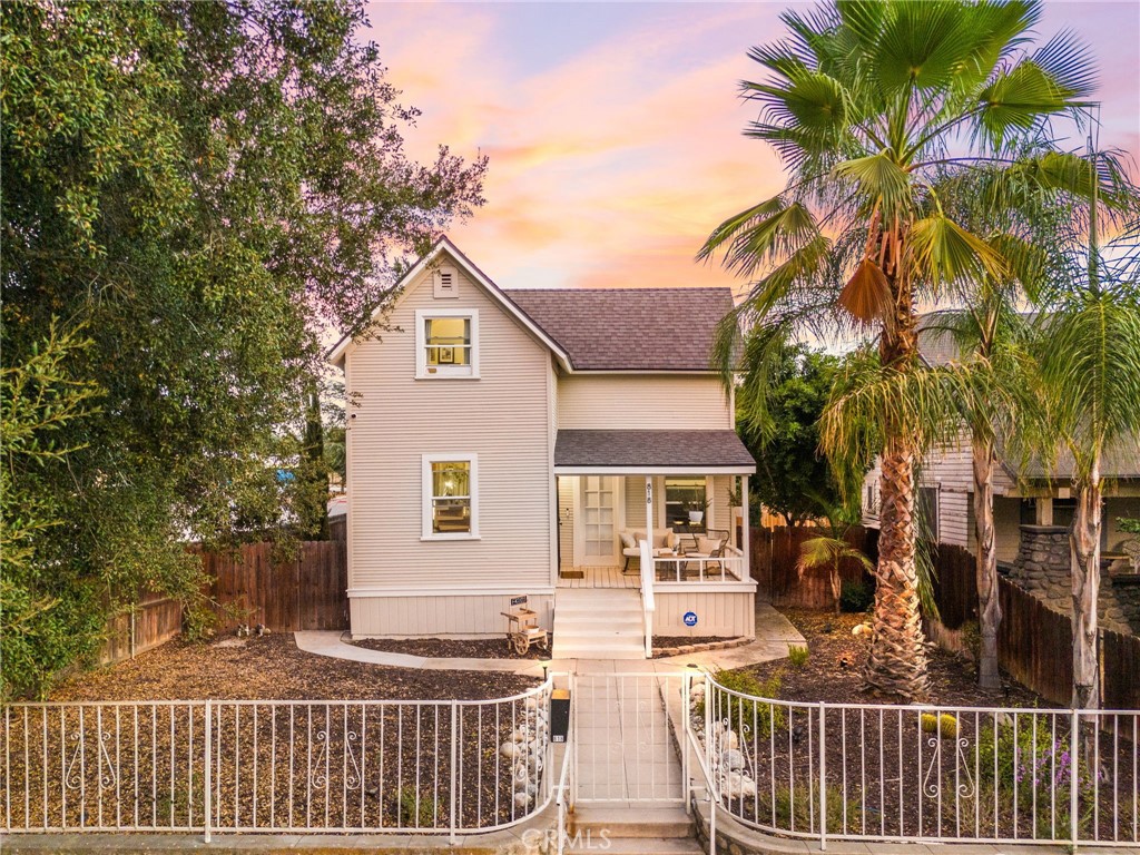 Quintessential Redlands Folk Victorian – Updated & Move-In Ready. Step into this 1901 Folk Victorian that perfectly blends timeless charm with modern farmhouse style. Ideally located in the heart of Redlands, it’s an easy walk to downtown, just steps from Franklin Elementary (a top-rated school offering GATE and maker programs), the University of Redlands, and the Metrolink Arrow train, and only 10 minutes to Loma Linda Medical Center. Beautiful, well-lit paths with historic Redlands lights and original granite curbs make every dog walk or neighborhood stroll a pleasant experience, filled with ease and beauty any time of day or night. The spacious low-water front yard is perfect for gardening, catching up with neighbors, or relaxing on the porch at sunset with mountain views. Inside, the home shines with LVP White Oak flooring, abundant natural light from dual-pane windows, an open floor plan, a first-floor primary bedroom, and a brand-new kitchen with custom cabinets, white quartzite countertops, and new appliances. Additional upgrades include remodeled bathrooms, updated plumbing, a separate indoor laundry room, and a roof only four years old. The backyard is a dream with a detached ADU that can serve as a 5th bedroom, studio, or office, plus a basement for extra storage and a shed on a permanent foundation. The landscaped, low-maintenance yard with mature fruit trees is perfect for BBQs, entertaining, and enjoying sunsets. Rear parking includes a remote-controlled gate, newly paved private cul-de-sac alley access, and multiple extra parking spaces. Future-ready with city-approved plans for a second full luxury ADU and a 3-car garage with pull-through access—ideal for hobbyists, cars, or RVs. This turnkey home offers timeless charm in one of Redlands’ most desirable neighborhoods where quality of life abounds. Don’t miss your chance—schedule a private showing today!