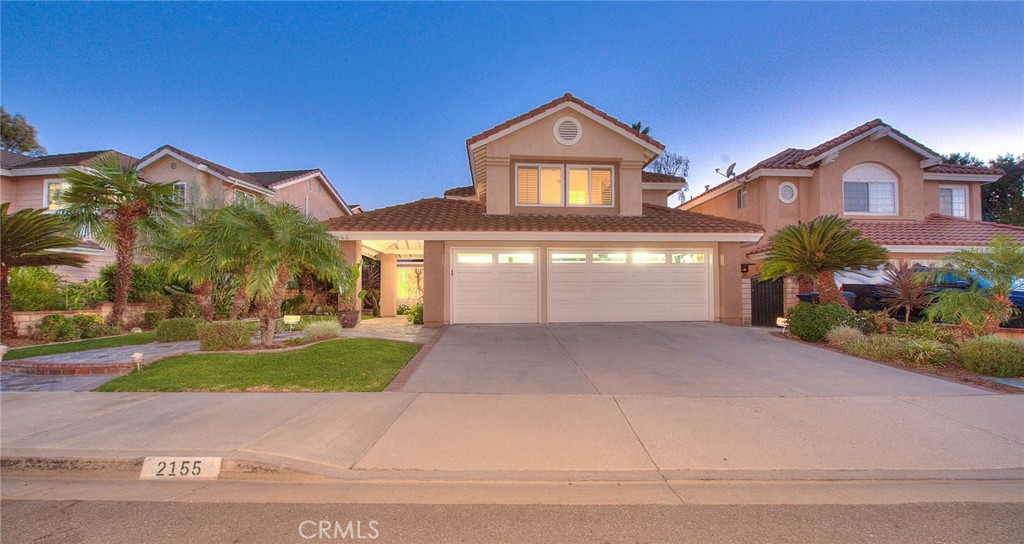 Welcome to this highly upgraded and remodeled North side Chino hills home with 4 bedrooms, a loft, and a tropical themed back yard pool/spa oasis. Encompassing 2811 sf with a spacious 8112 sf private lot. This residence was quality built by Richmond America Homes. The curbside presence will invite you in. Slate stone trimmed walkways lead to a covered porch and dual entry glass doors. The foyer is grand in size with wood floors that flow through the living, dining, family room and kitchen. A permitted loft adds over 300 sf and allows for a second family room, children's play area, or perhaps an open feel office. The kitchen was expanded by eliminating the nook area. Now a sink (looking to the backyard) and extra cabinetry fills the space. A large center island was added with extra storage and bar seating for everyday informal meals. European appliances and a built-in refrigerator provide elegance. There is a built-in oven, microwave, gas cooktop, & a commercial grade exhaust hood. Cabinetry is custom with slide out shelves for pots and pans. There are gorgeous granite countertops and recessed lights. The kitchen is open to the oversized family room (the downstairs bedroom was removed but can be brought back). There is a handy bar area with beverage cooler for entertaining. The pool table is negotiable, as is the majority of the home's furniture- all are high quality. A 3/4 bath with a walk-in shower and a laundry room are off of the family room. Upstairs are 4 bedrooms and the loft. The staircase has been elegantly updated. More wood floors grace the loft and hallway. Wood shutters with newer Milgard dual pane windows provide extra insulation and quiet. Custom lighting and plumbing fixtures are throughout. The primary bedroom has vaulted ceilings and a double door entry. The elegant bathroom boasts twin vanities, a walk-in shower, a separate soaking tub and a walk-in closet with organizers. Pool parties and backyard get togethers will be second to none with a rock pool/spa with pebble finish. a grotto sits under the waterfall feature. Lush landscape covers the slope. A palapa covered barbecue island with bar seating and additional pool furniture pad will be a favorite hangout. Ideally located near Costco, the Shoppes, Chino Spectrum, and Ranch 99 market, along w/easy freeway access to the 60 and 71. Chino Hills has sought after schools, community parks, and a rural feel lifestyle. Come visit and fall in love!