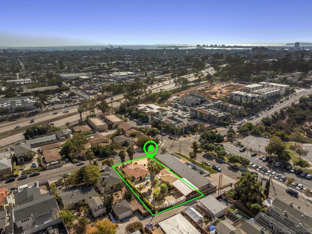 Excellent development or investor opportunity in Golden Hill, north of the 94! Situated on a large, flat .24 acre (10,625 sqft) lot with alley access. The property currently features a 3-bedroom, 1-bath, 1,043 sqft house, plus a permitted 415 sqft studio ADU with a private bath and laundry. There is also a large 35’x26’ carport off the alley that allows for ample parking. Whether you're a developer looking to capitalize on the location or an owner-occupant wanting an ADU/extra unit, this property provides the flexibility and potential for growth. Ideally located on the north side of the 94 near Downtown San Diego, Southpark, Balboa Park, local restaurants, bars, and shops, with easy freeway access for a quick commute anywhere in the city. This is a rare opportunity to own a versatile property in one of San Diego’s most desirable and convenient neighborhoods.