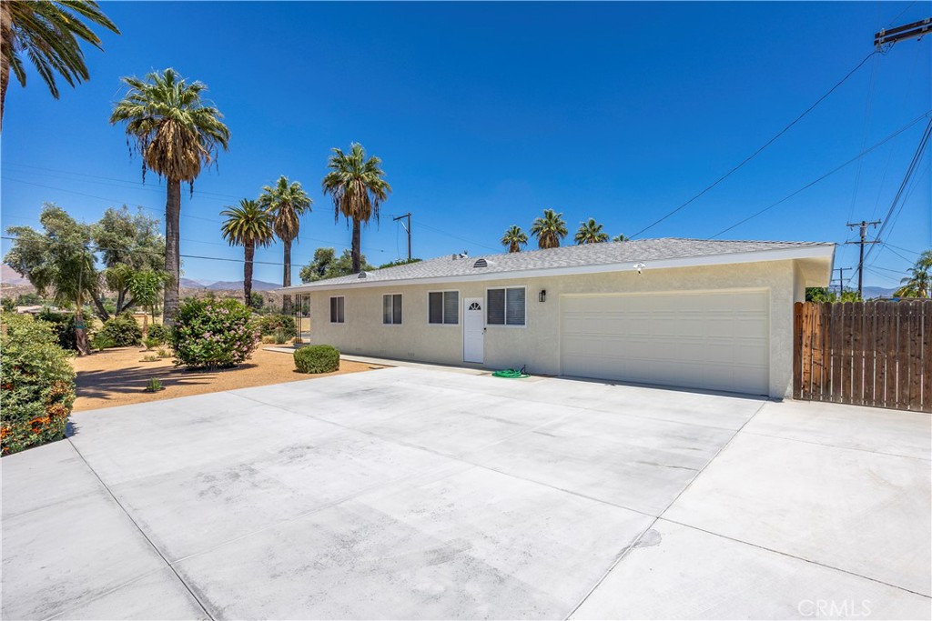 Welcome to this beautifully maintained and upgraded East Hemet home offering the perfect blend of comfort, functionality, and outdoor convenience. Bring your boat, work trucks, RV or trailer! Plenty of space for your outdoor toys and equipment with the double RV access on both sides of the property, complete with hookups and a clean-out, this home is ideal for those who love to travel or need extra parking and storage flexibility.
Inside, you’ll find a warm and inviting atmosphere, highlighted by real oak flooring in the bedrooms and hallway. The interior has been freshly updated with new paint throughout, updated double-pane windows for energy efficiency, and a new AC system and water heater for year-round comfort. The kitchen includes a new garbage disposal, and blown-in attic insulation helps keep utility costs down.
In addition to the two officially listed bedrooms, there’s a versatile third room—perfect for use as a guest room, office, or additional sleeping area.
The exterior is just as thoughtfully upgraded, featuring a low-maintenance yard with a drip irrigation system for plants, and fresh paint that enhances curb appeal.
Located near schools, shopping and restaurants.
Don’t miss the opportunity to own this move-in ready home with space, style, and functionality!