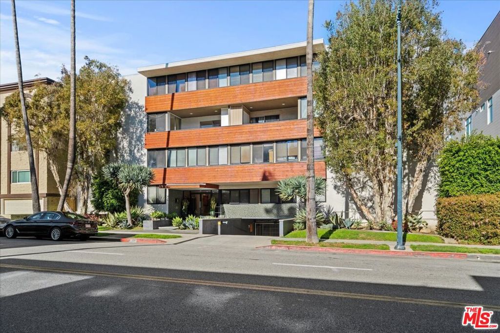 Welcome to this expansive condo in the heart of Beverly Hills, just blocks from world-class shopping and dining. Step inside to a spacious living room, perfect for entertaining. To the left, a cozy family/media room offers a versatile space to relax. To the right, a renovated kitchen features granite countertops and ample cabinetry. This home boasts two large balconies, a dedicated dining area, and generous natural light throughout. The primary suite includes an ensuite bath and ample closet space, while the guest bedroom also features a large closet and sits conveniently next to the guest bath. Additional highlights include in-unit laundry, abundant storage, great lighting, and a Nest thermostat for modern comfort. This condo offers the ideal blend of space, style, and location.