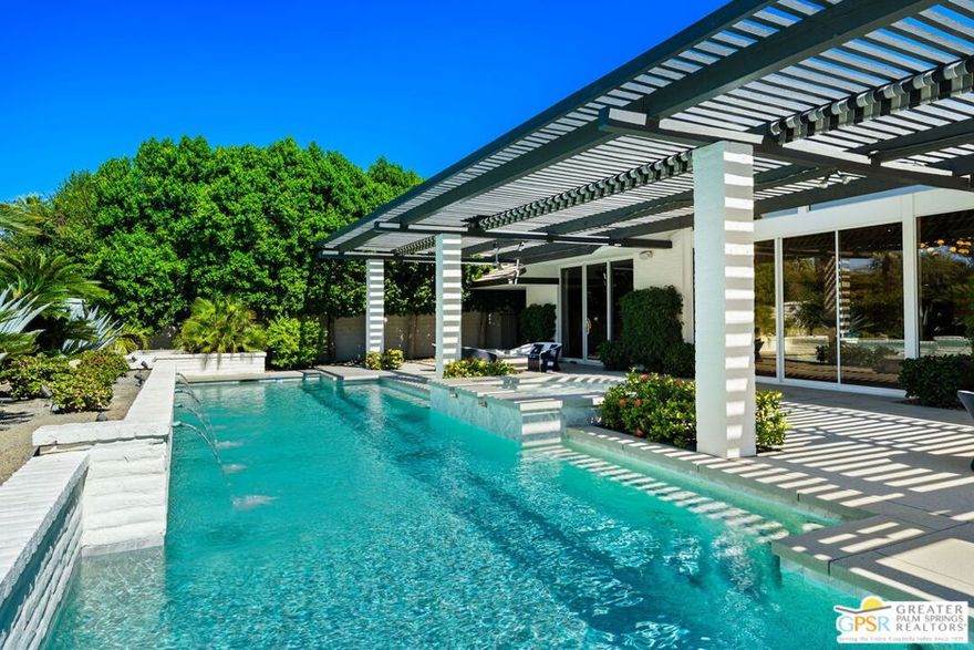 Welcome to this stunning luxury home, where timeless elegance meets modern sophistication. From the moment you arrive, you'll be captivated by its grand presence, impeccable craftsmanship and resort-style amenities designed for both comfort and entertaining.Step inside to soaring ceilings, Terrazzo tile floors, expansive windows that flood the home with natural light and an open concept floor plan that blends seamlessly from one space to the next. The chef's kitchen is truly outstanding, featuring custom cabinetry, a Walker Zanger backsplash, quartz countertops, and high-end Decor appliances, including a 48" range with a steam oven, two dishwashers, and a chef's sink. Stylish Kelly Wearstler pendant lights add a designer touch. The dining area and intimate breakfast nook provide flexible dining options. Retreat to the primary suite, a true sanctuary featuring a walk-in closet, a secondary closet, and built in dresser. Two additional spacious en-suite bedrooms provide luxurious accommodations for family and guests. A versatile office/media room with custom cabinetry can be converted into a fourth bedroom. Outdoors, the meticulously landscaped grounds showcase a sparkling pool and Spa, lounge areas, and an outdoor kitchen for unforgettable entertaining. Every detail of this home was designed with sophistication, comfort, and desert lifestyle in mind. This is more than a home  it's a statement of luxury living.
