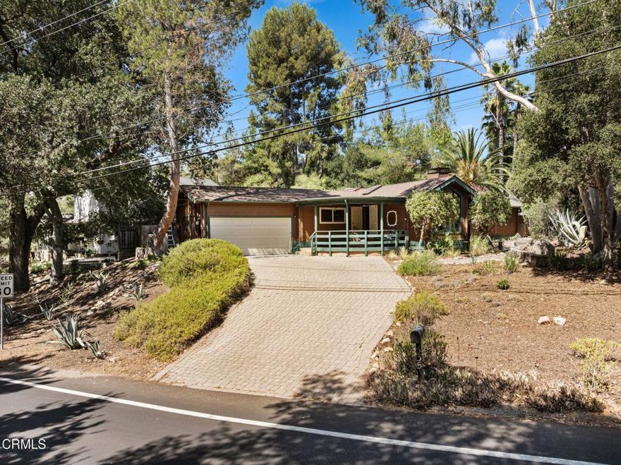 Welcome to this beautifully maintained 3-bedroom, 2-bath home offering nearly 2,000 square feet of living space on a quarter-acre lot in the heart of Ojai. Built with solid cedar wood construction and thoughtfully updated over the years, this home features a spacious living room with a fireplace, a library with custom built-ins, maple wood flooring, a bright dining area, and remodeled bathrooms completed in 2025. A versatile back unit with a wet bar and separate entrance provides endless possibilities such as a studio, office, or rental opportunity.Recent improvements include updated plumbing with a transferable warranty, newer windows, roof, and A/C replacements, along with a whole-house fan. The landscaped yard is highlighted by fruit trees, flowering plants, and mature oaks, creating a peaceful setting for outdoor enjoyment. The two-car garage includes side panels that open for natural light and ventilation, making it suitable for a potential workshop.Located within walking distance to Downtown Ojai, Libbey Park, farmers' markets, restaurants, shops, trails, and cultural venues, this property offers the perfect blend of comfort, convenience, and natural beauty.